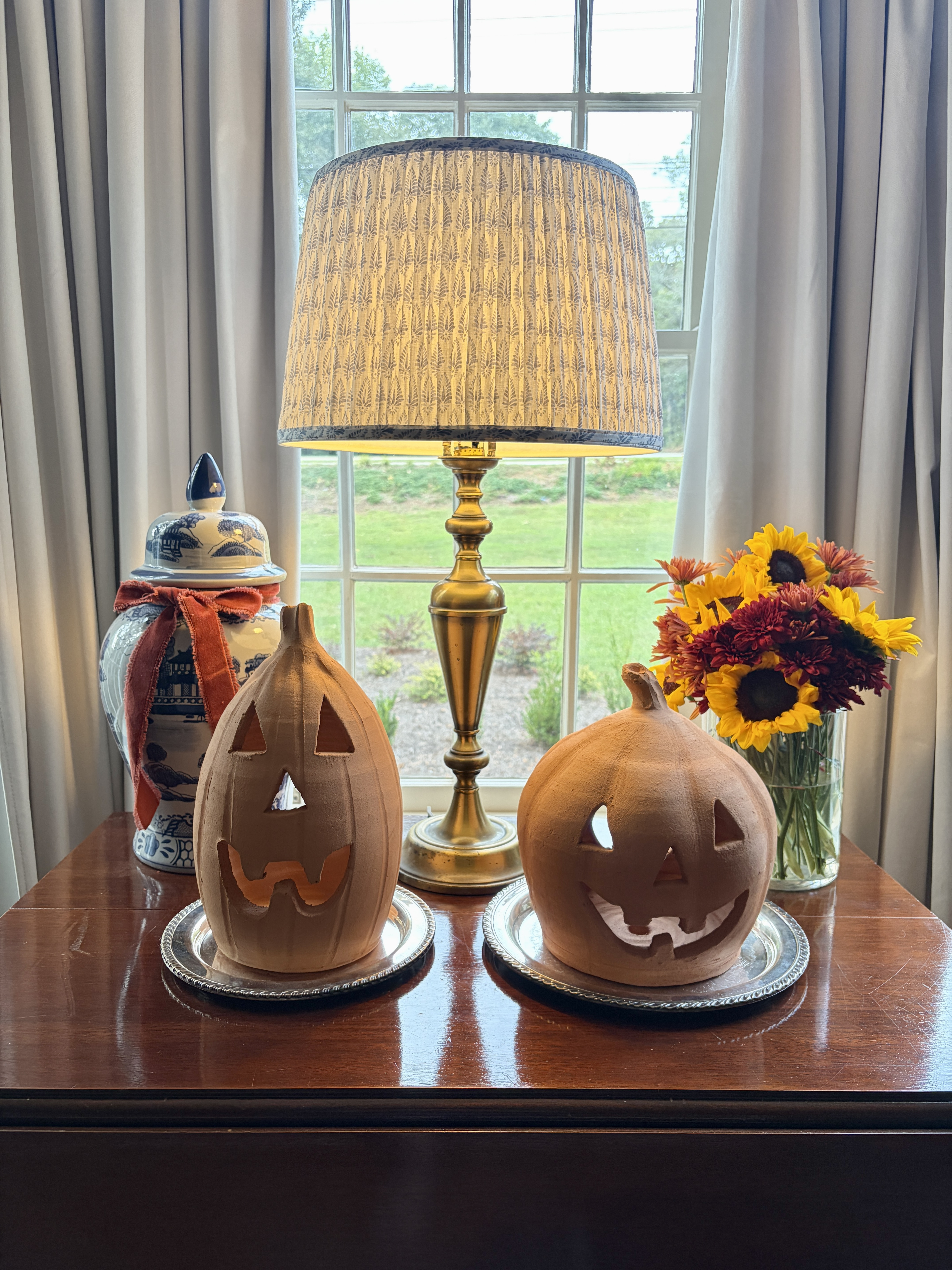 With a few thoughtful additions to our everyday decor, we're ready to celebrate the fall season.

Terracotta pumpkins get an elevated look atop these silverplate trays. A ginger jar gets a glow-up with a length of velvet ribbon.

Follow @belleantiquarian for more lifestyle inspiration.  

 #LTKSeasonal #LTKHome