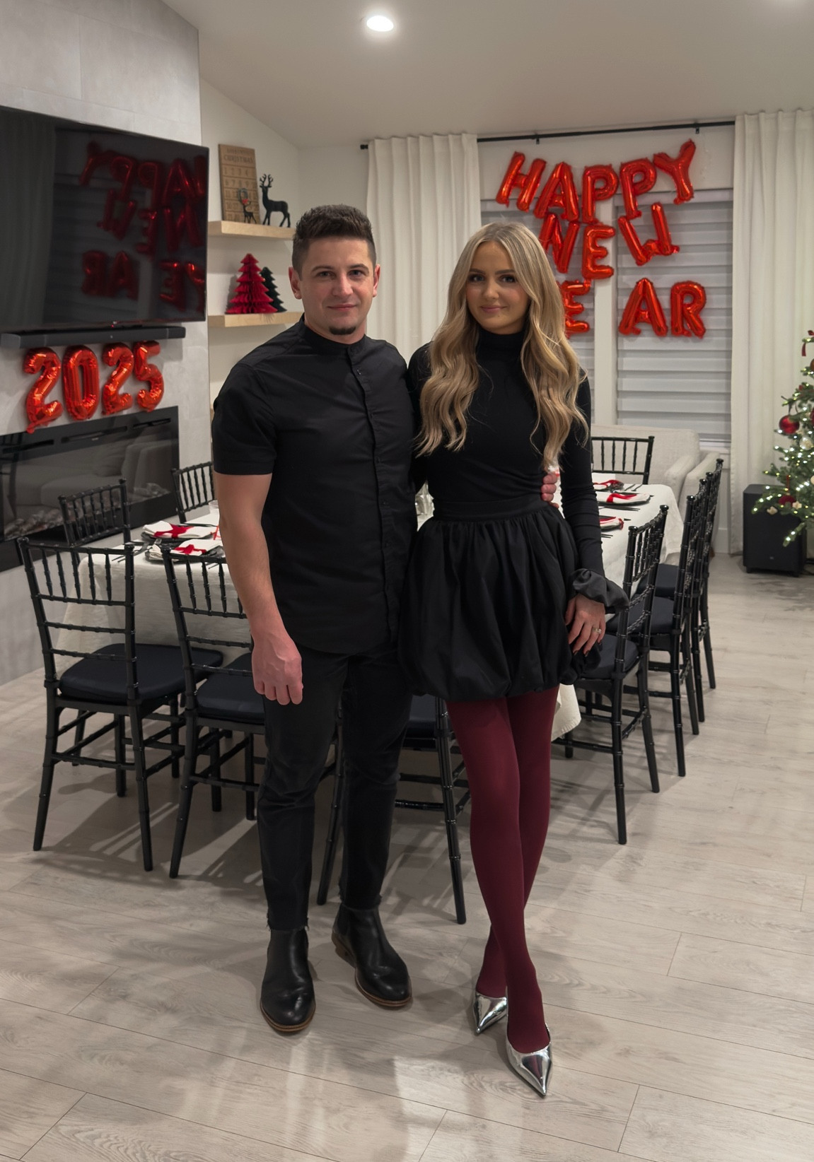 Black bubble ballon skirt, burgundy tights, silver kitten heel. Black turtleneck trumpet sleeve. 

#LTKSeasonal #LTKU #LTKSaleAlert