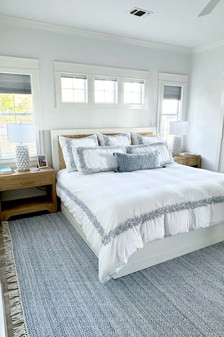 Beautiful blue and white bedroom featuring Serena and Lily embroidered seersucker betting
Serena and Lily, blue and white rug 
Rope and raffia, bed and side tables 


#LTKhome