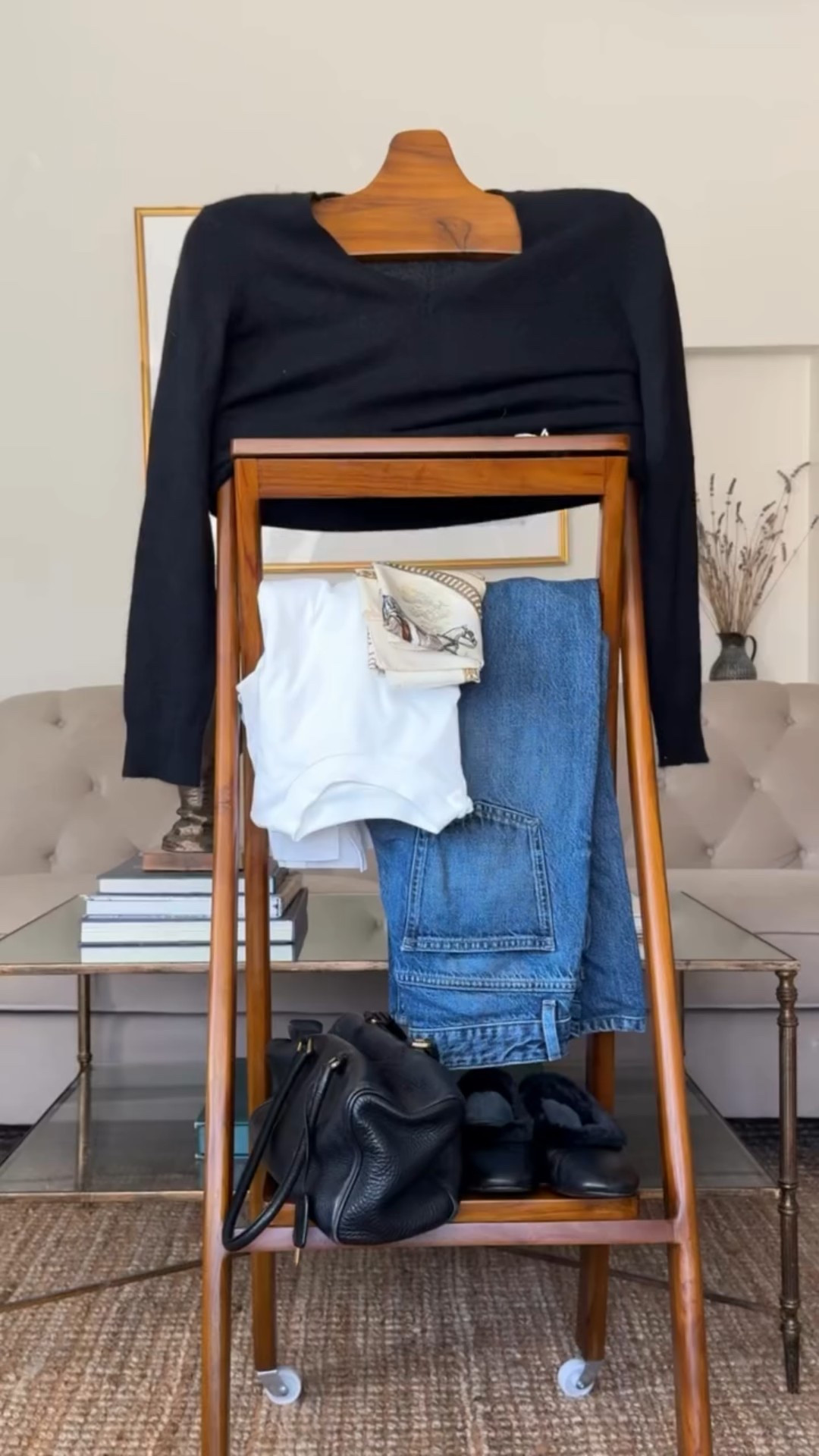 Week 5 of 52. This is how I style the cashmere vneck sweater - layered over a simple plain tee and paired with wide-leg jeans for an easy, timeless, relaxed look for everyday wear. 

I completed the ballet flats - comfortable, classic, and very on trend right now. 
Minimal jewelry keeps the look clean. 

To add some interest and polish to the look add a scarf and layer it over the necklace. This keeps the outfit feeling modern, polished, and never stuffy. 

And to finish it off, a classic black leather bag - because a great bag pulls everything together.
This is proof that a capsule wardrobe doesn’t have to be boring—just intentional.
Head to my link to shop this look. 

Be sure to follow along each week as I restyle our capsule wardrobe and share fresh ways to update and elevate our looks.

#the52weekedit #capsulewardrobe #affordablestyles #sustainablestyle #cashmere