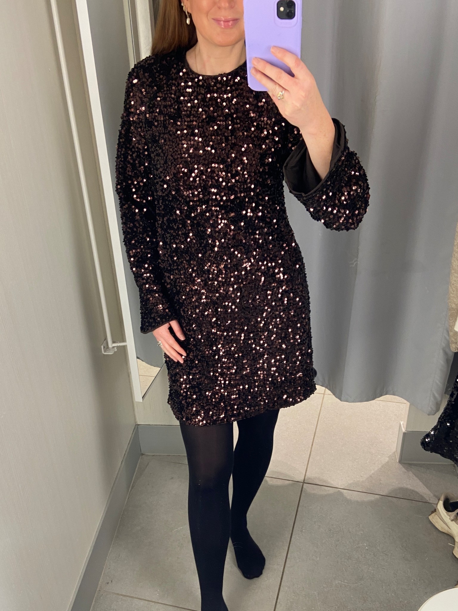 Holiday party ready ✨ This chocolate brown sequin dress is perfect for festive cocktails, dinners, or any winter celebration. Loving the sparkle and easy fit—so chic with heels! I’m wearing a size small. Christmas outfits, sequin trousers, party outfits, sequins, Christmas party outfits, chocolate brown 

#LTKuk #LTKpartywear #LTKfestive