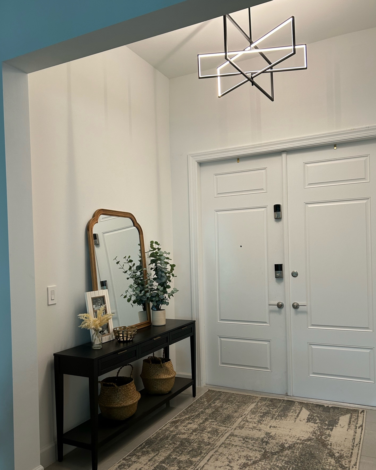 Our foyer post renovation! We closed it in by lowering the ceiling and adding this killer chandelier. We’re thinking of adding some color or texture to the walls somehow. Thoughts!? Like everything, it’s a work in progress! We have a tonnnn of other more pressing projects to tackle first. 

#LTKSpringSale #LTKhome #LTKSeasonal