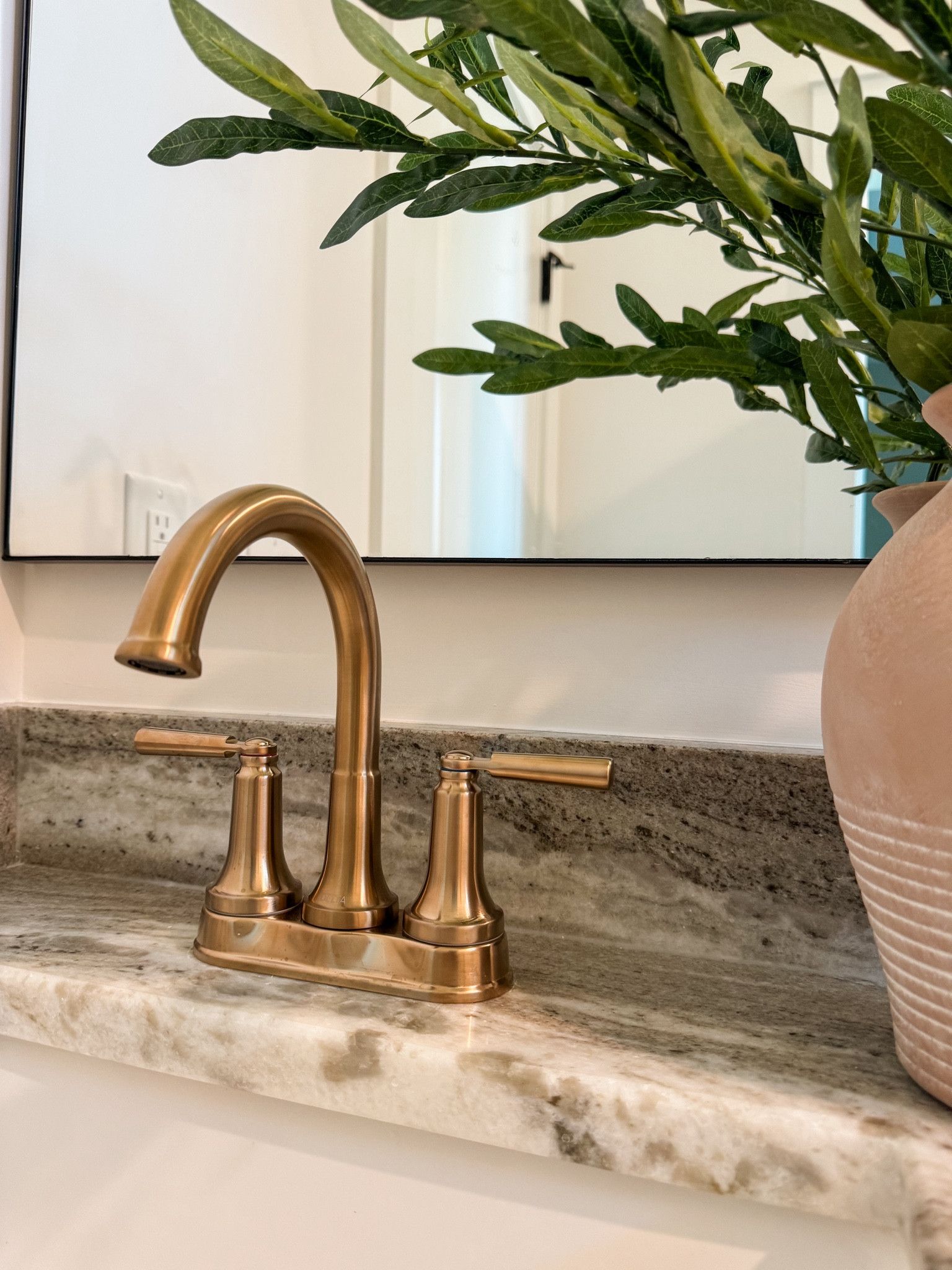 ✨From builder grade bathroom to designer-inspired with Lowe’s Home Improvement | Part II 

I can’t stop staring at this gorgeous faucet! This is the Delta Saylor in Champagne Bronze and it’s the perfect mix of classic and modern for this transitional style bathroom
 
First time changing out a faucet myself - YouTube is an amazing teacher and honestly it wasn’t as hard as it may seem, just takes time and patience. 

Stay tuned and follow along @oak.haus.collective as I turn this into an intentionally designed guest bathroom, I know my guests are going to love!
 
Bathroom makeover, bathroom design, transitional bathroom, modern bathroom, gold faucet, bathroom faucet 

#LTKHome #LTKFamily
