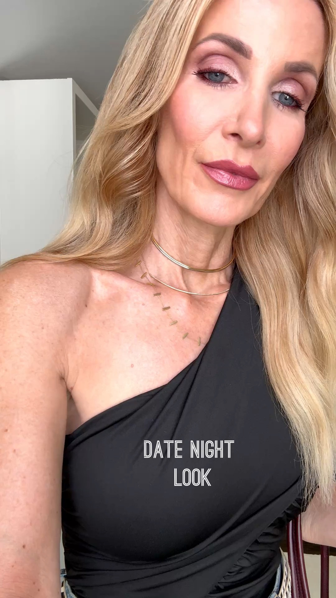 This black one-shoulder bodysuit is fabulous for date night! The flattering ruched detail and open back add a sexy, elevated touch to classic high-waisted jeans. I’m wearing an XS in the bodysuit and a 24 in the jeans. #DateNightOutfit #OneShoulderTop #BodysuitStyle #JeansOver40 #WomenOver40Style 

 