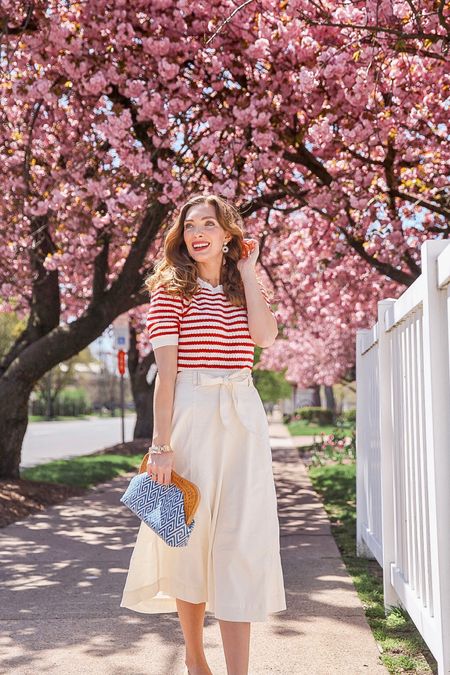 Nautical vintage vibes, perfect for easy summer days right around the corner! This gorgeous white skirt has a nice heavy fabric (lining is top notch) and my favorite vintage vibes while this lightweight striped sweater is perfect for the cool spring mornings and warm afternoons. The woven ballet flats have cute white polka dots on them and go with literally any outfit 🌸 All fit true to size #LTKfindsunder100 #LTKworkwear