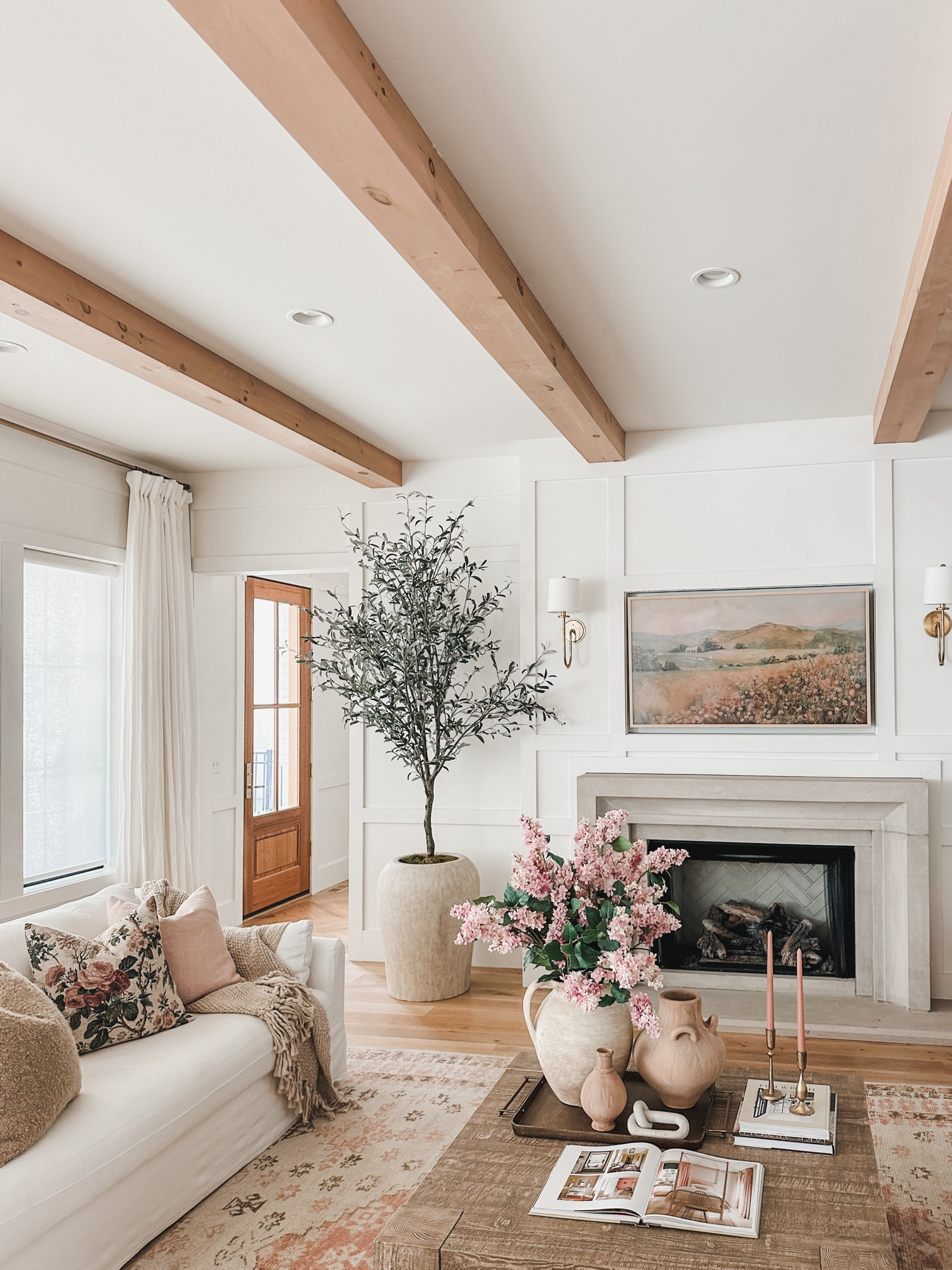 Pottery Barn style living room views showcasing featuring a light and airy summer refresh with neutral tones and pops of pink!

Living room refresh, summer refresh, Pottery Barn style, neutral wood tones, pops of pink, creamy whites, neutral area rug, coffee table finds, furniture favorites, faux florals, throw pillow, accent chair, curtain detail, living room views, light and bright, coffee table decor, throw blanket, neutral home, aesthetic finds, shop the look!