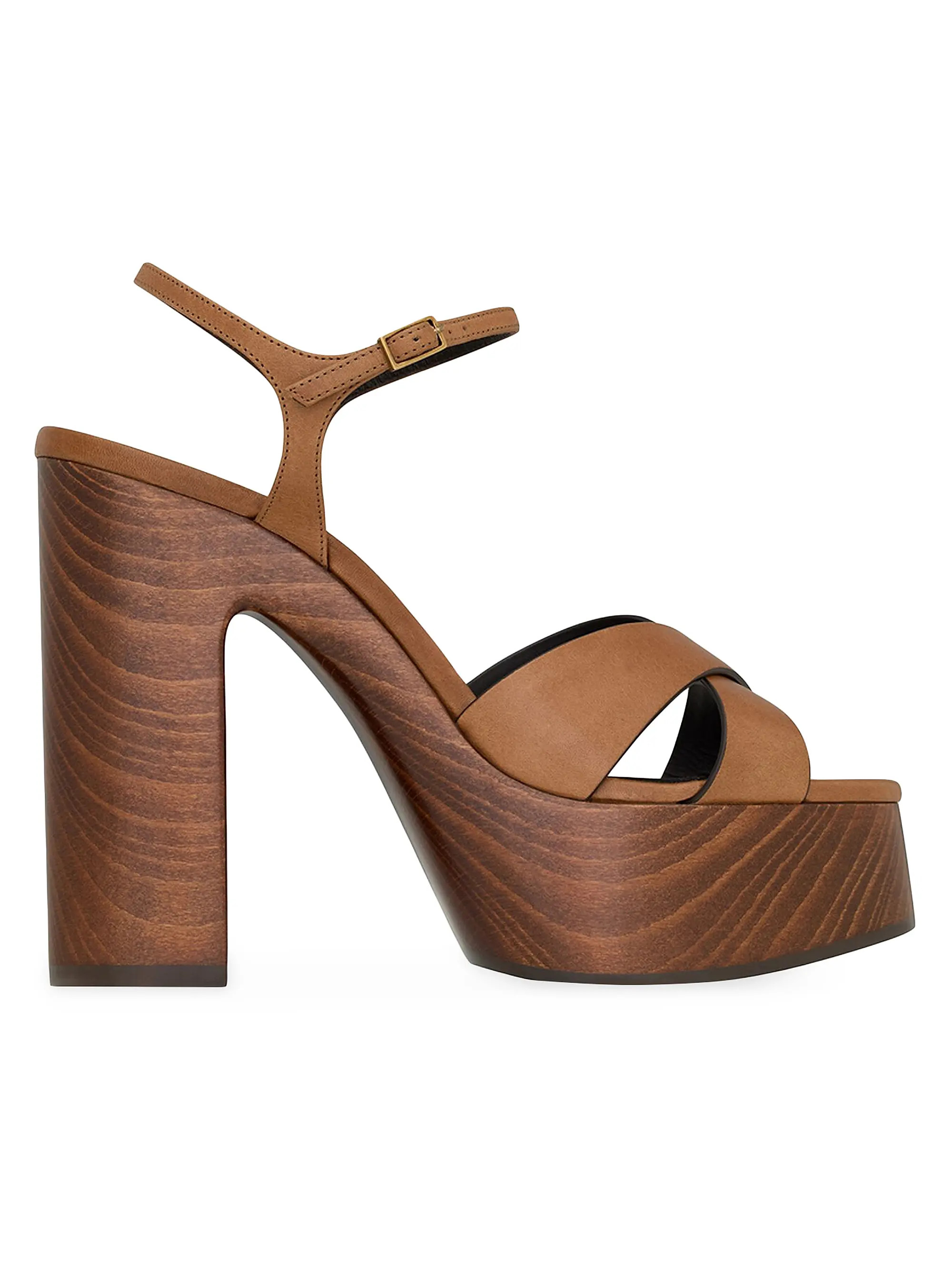 DetailsPlatform sandals with a crisscrossed front, featuring an adjustable ankle strap and wooden... | Saks Fifth Avenue
