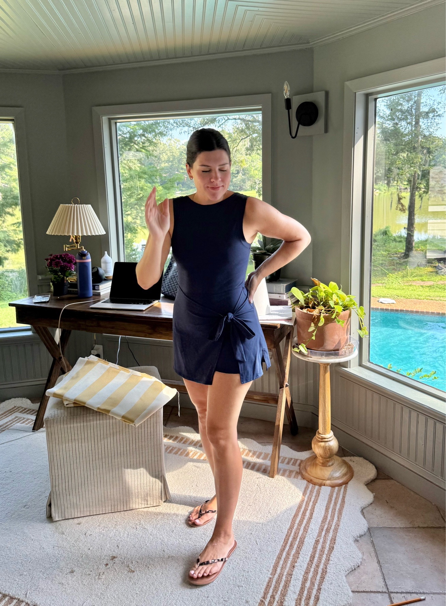 "The perfect athletic dress for busy days that start at the desk and end by the pool ☀️💻👟 This navy workout dress with built-in shorts and a flattering tie waist moves with you—whether you're running errands, chasing kids, or squeezing in a walk between Zoom calls. True to size, super comfy, and under $100. #AthleisureStyle #ActivewearDress #LTKfit #LTKunder100 #LTKsummer #MomStyle #TennisDressVibes #PoolsideChic"