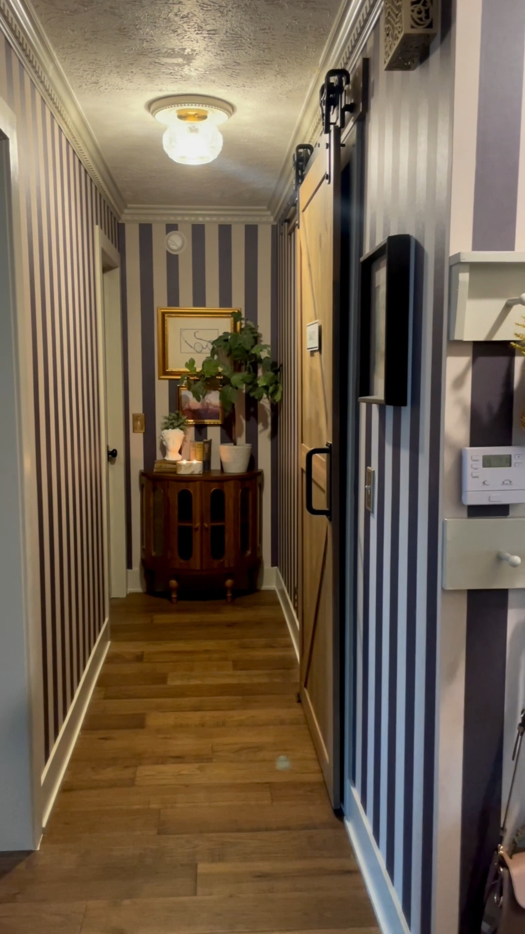 This hallway leads to our master bedroom, so everyday I get to see this view. It makes me so happy! Honestly such a small space and so easy to overlook, but now it’s a statement. I found the perfect semi-circle table for the end of the hallway so we never bump it when we walk out, and it added storage and visual interest. Gorgeous wallpaper from @lucieannabelwallpaperus