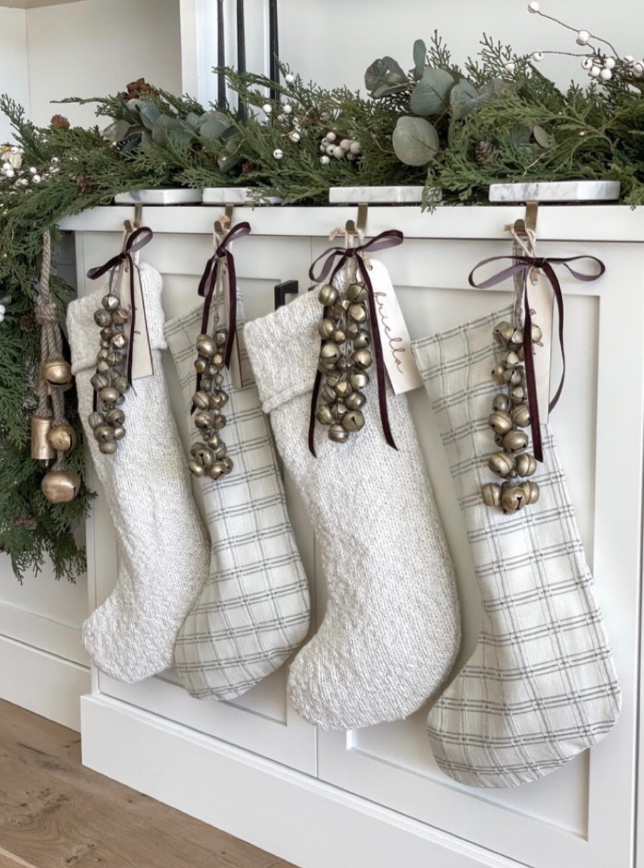 Although my stockings are no longer available, I linked many that are similar in color scheme! I especially love our name tags from Etsy. 

neutral Christmas stockings, knit stockings neutral, cream cable knit stocking, velvet ribbon Christmas décor, velvet ribbon bows, small brass bells, hanging bells Christmas, antique gold bells, stocking name tags, personalized stocking tags, neutral holiday décor, organic modern Christmas, natural Christmas decorations, minimalist holiday décor, warm neutral Christmas, Christmas mantel styling, neutral stocking holders, brass stocking holder, velvet holiday ribbon, Christmas gift wrapping accents, neutral tree decorations, simple Christmas mantel, beige Christmas décor, rustic holiday stockings

#LTKSeasonal #LTKStyleTip #LTKHoliday