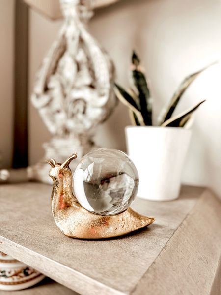 Summer Nightstand Decor. Gold decorative objectives.  Snail Scuplture. Anthropologie. 

#LTKhome #LTKstyletip #LTKfindsunder50