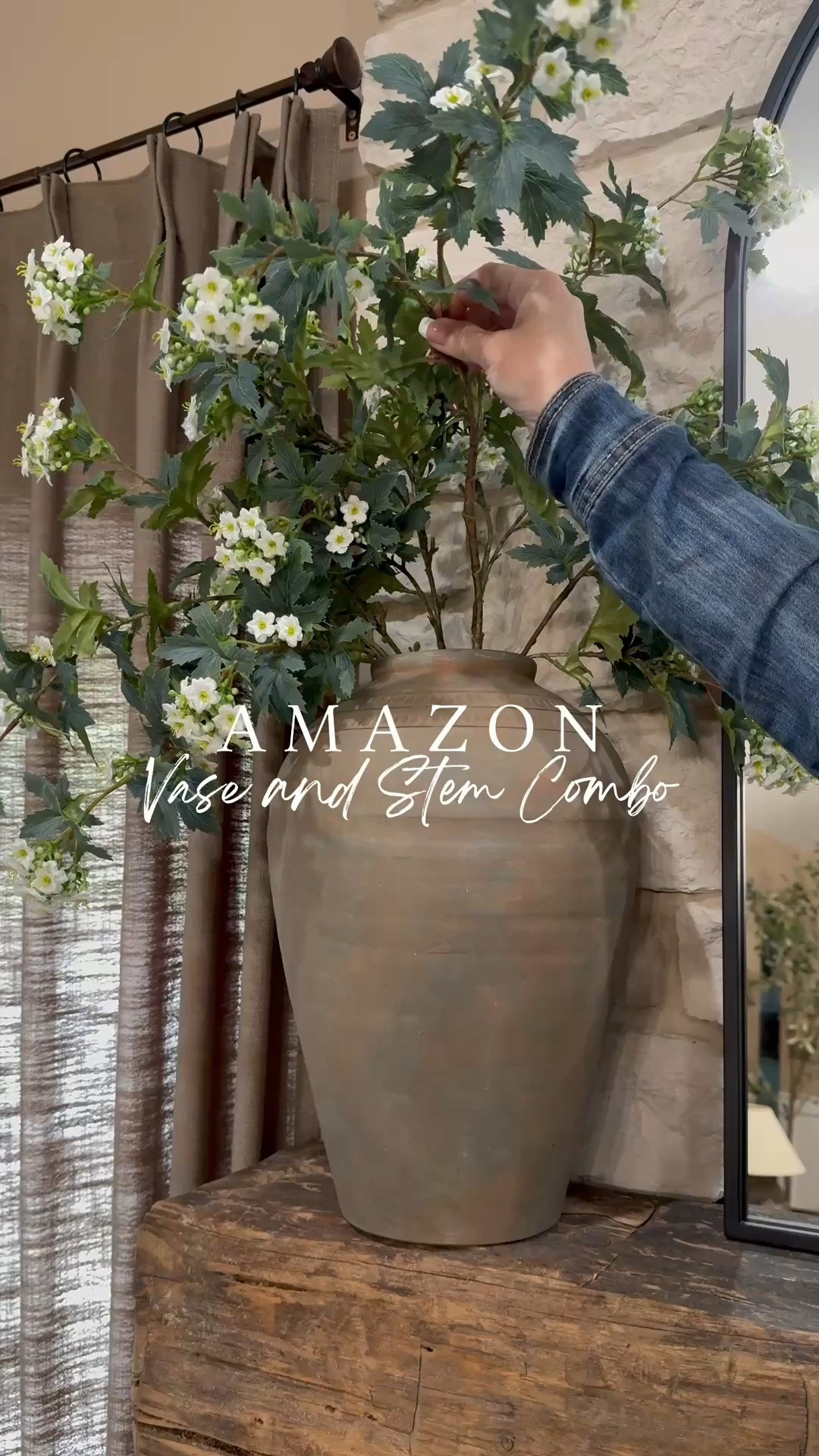 Amazon Vase And Stem Combo

Follow @farmtotablecreations on Instagram for more home inspiration, styling ideas, and curated finds.

This Amazon vase and stem combo is one of those decorating pieces that instantly makes a space feel finished. The oversized rustic vase brings warmth and texture, while the delicate white stems add softness and height without overwhelming the room. Whether it’s styled on a console table, entryway cabinet, mantel, or sideboard, this timeless combination creates that collected designer look with minimal effort.

I used 6 stems in this vase to create a full, airy arrangement with beautiful movement and natural dimension. It’s an easy way to add height, texture, and a designer-inspired touch to any space.

#vase #stems #homedecor #decorfinds #livingroom #mantledecor

#LTKHome #LTKSaleAlert