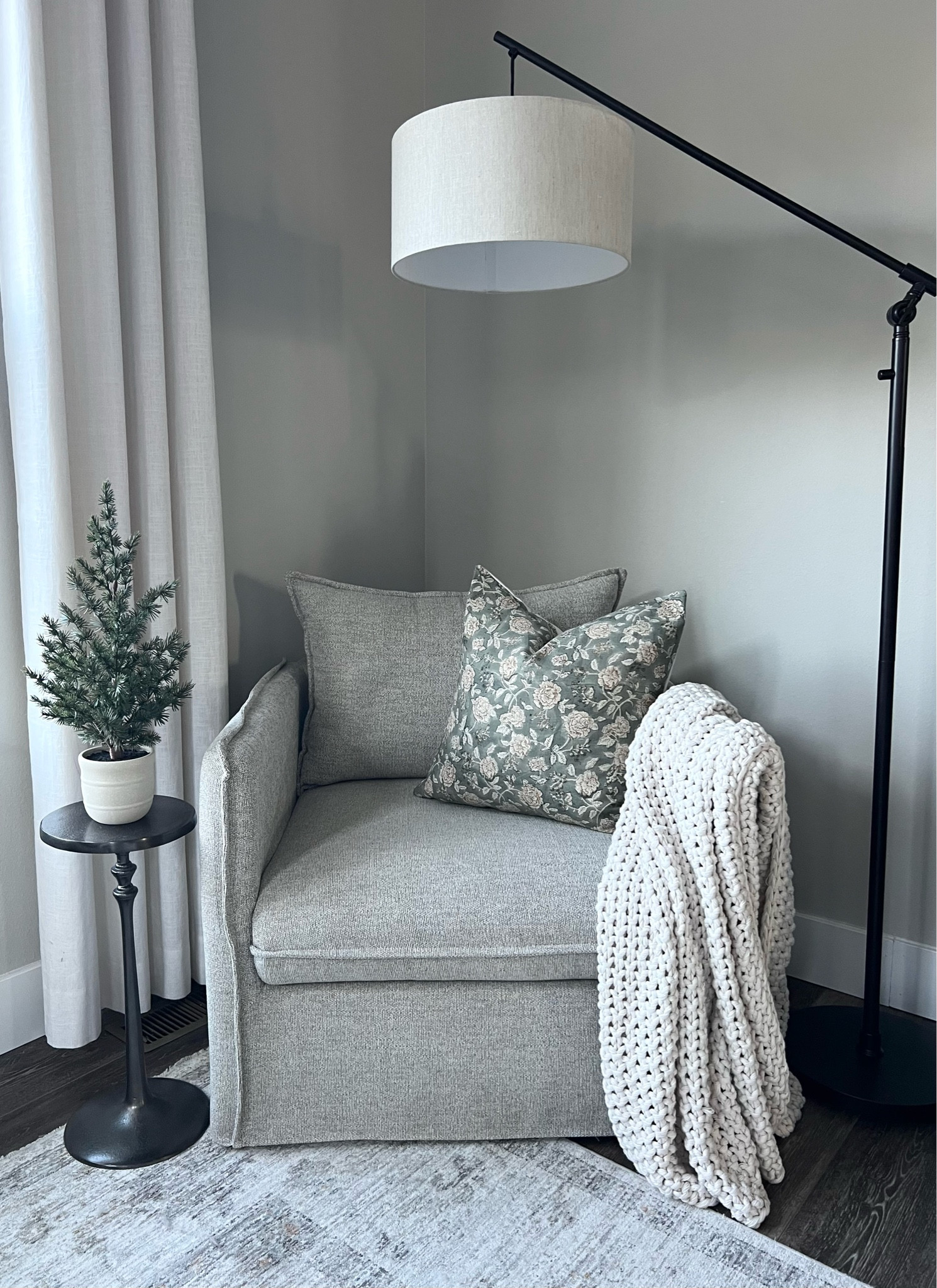 Bedroom reading nook. 

Slipcover chair / slouchy chair / drink stand / pillow covers/ knit blanket / throw / mini Christmas tree / floor lamp / Target / pottery barn / neutral bedroom / neutral furniture 

#LTKFindsUnder100 #LTKHoliday #LTKHome