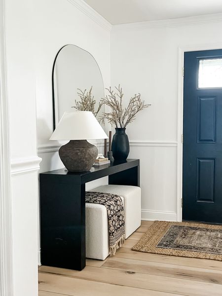 Console table, brown lamp, arch mirror

#LTKhome