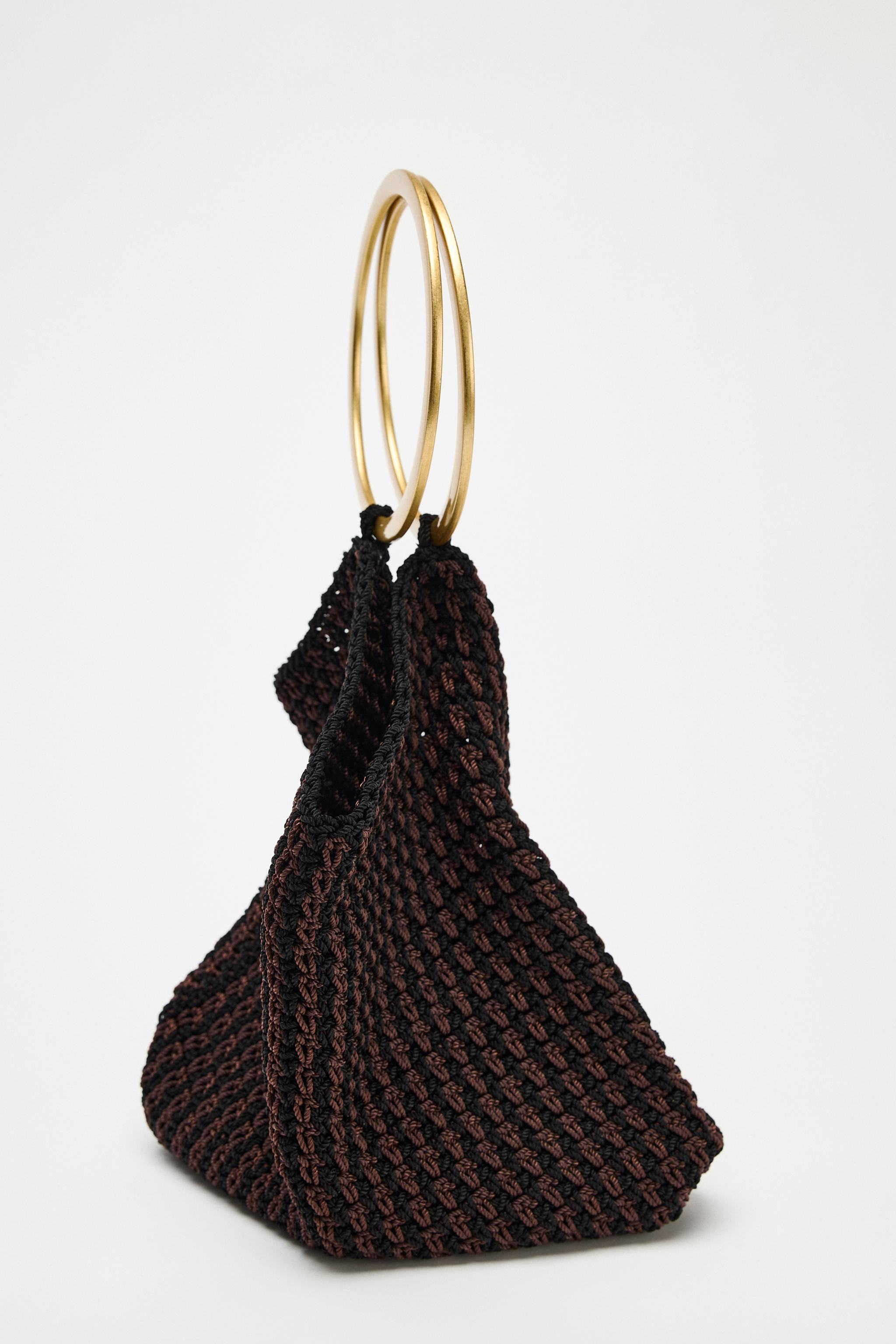 Mini bucket bag with woven top. Double circular metal handle. Inner pouch with drawstring closure... | Zara UK