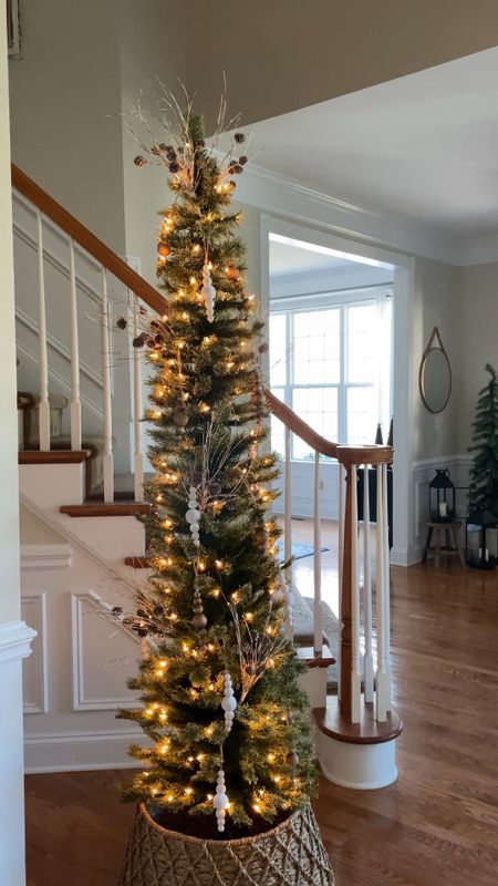 The best slim tree for any room in your home. Perfect for a empty corner or next to a staircase like shown here in my home. Add one in the bedroom. Or next to your a bookcase, China cabinet or dresser. On sale now! Grab one before they sell out! #christmastree #slimchristmastree #chrostmasdecorating #holidaydecor

#LTKsalealert #LTKHoliday #LTKCyberweek