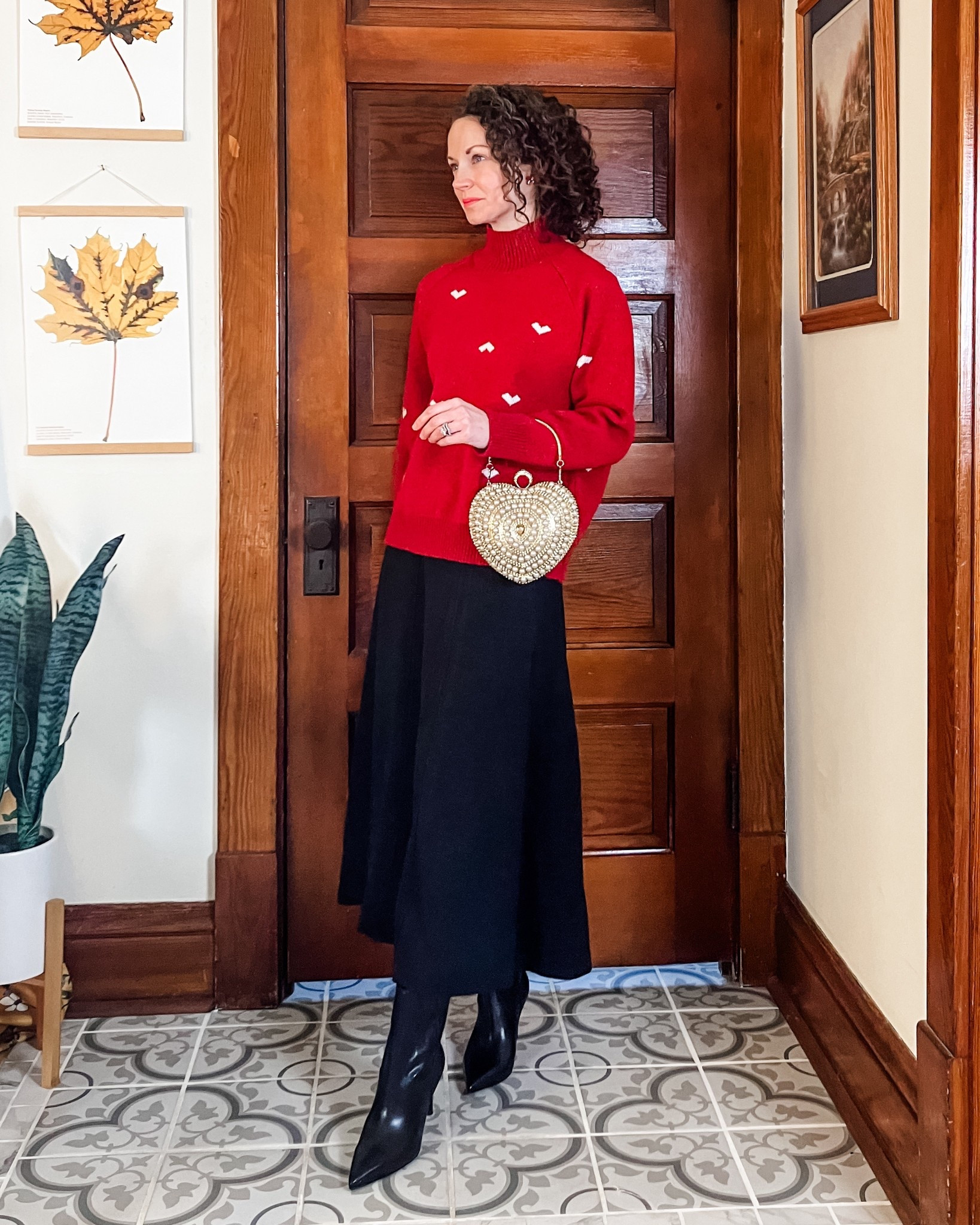 A red sweater, dark grey skirt and leather boots for Valentines Day!
Red heart sweater from Chicwish. 
Charcoal grey skirt from Chicwish. 
Black leather booties from Marc Nolan. 
Gold pearl heart purse from Chicwish. 
Petite outfit. Modest outfit. Valentines outfit. Winter outfit  

#LTKValentine #LTKOver40 #LTKSeasonal