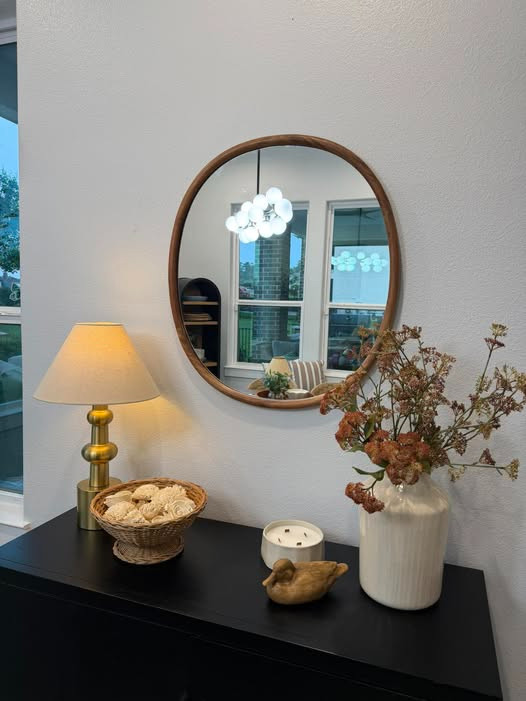 The little cozy corners are always my favorite 🤎✨
This affordable setup made SUCH a difference in my space — the warm wood mirror, soft lamp glow, and neutral textures give that calm designer look without spending a fortune 🙌

Obsessed with how simple pieces can make a room feel so elevated 😍

#LTKHome #NeutralHome #CozyDecor #HomeStyling #AffordableDecor #EntrywayDecor #HomeInspo #InteriorStyle #DecorFinds #LTKFinds 

 