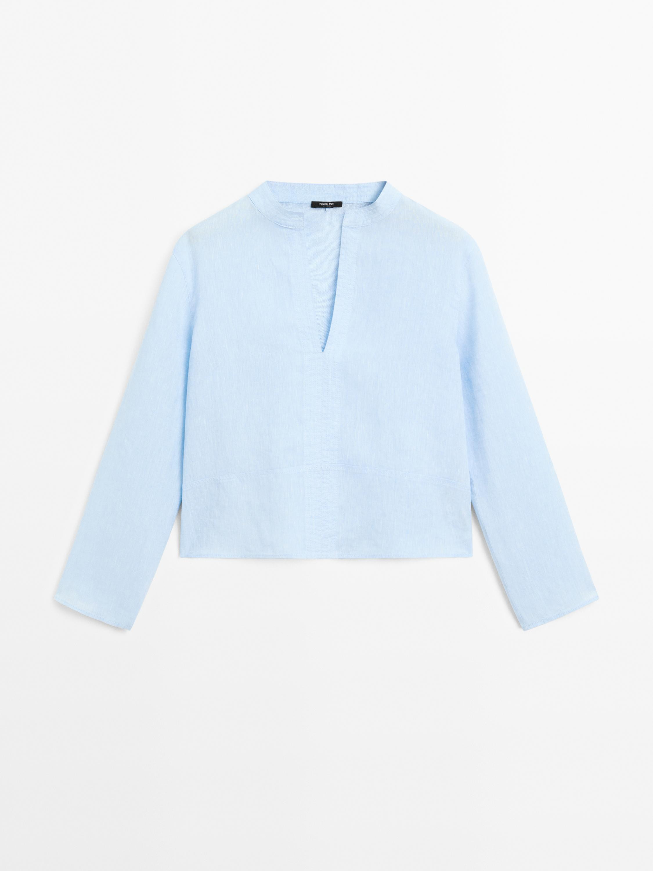 Shirt made of 100% linen chambray fabric. Stand-up collar with V-neck. Wide long sleeve. Seam det... | Massimo Dutti UK