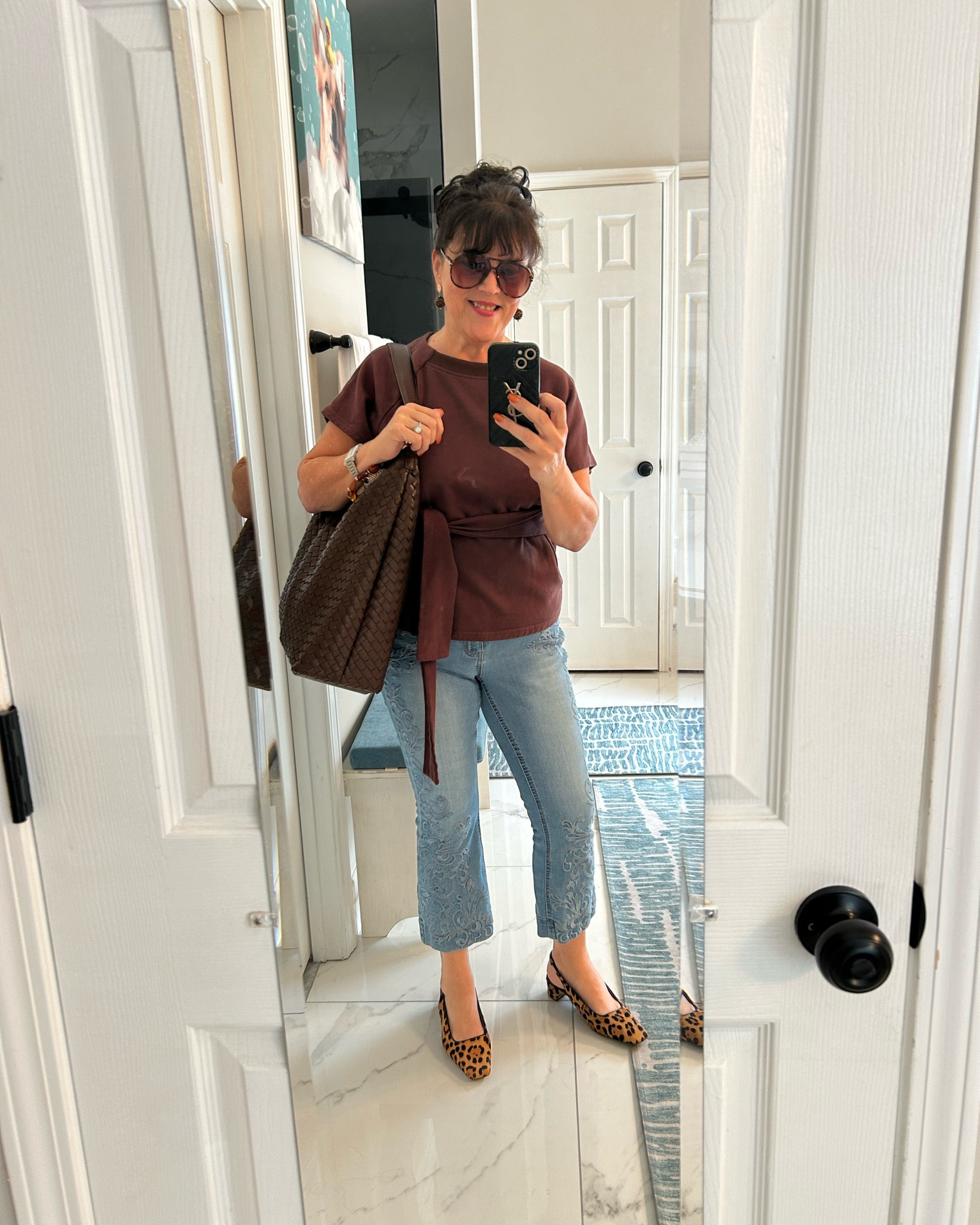 A football day outfit that doesn't mean sweatpants!! 🏈
Brown top with a tied waist, my light blue cropped jeans, and leopard flats — comfy enough to sit through the whole game, cute enough to actually get dressed for it. The big woven tote carries snacks, lipstick, and my sunglasses. Casual, but still put together.
Always be confident, ladies 💋
Are you a flats girl or a sneakers girl for game day?
#over50fashion #styleover50 #agelessfashion #midlifestyle #gamedayoutfit

#LTKvlog #LTKdayinmylife #LTKOver40
