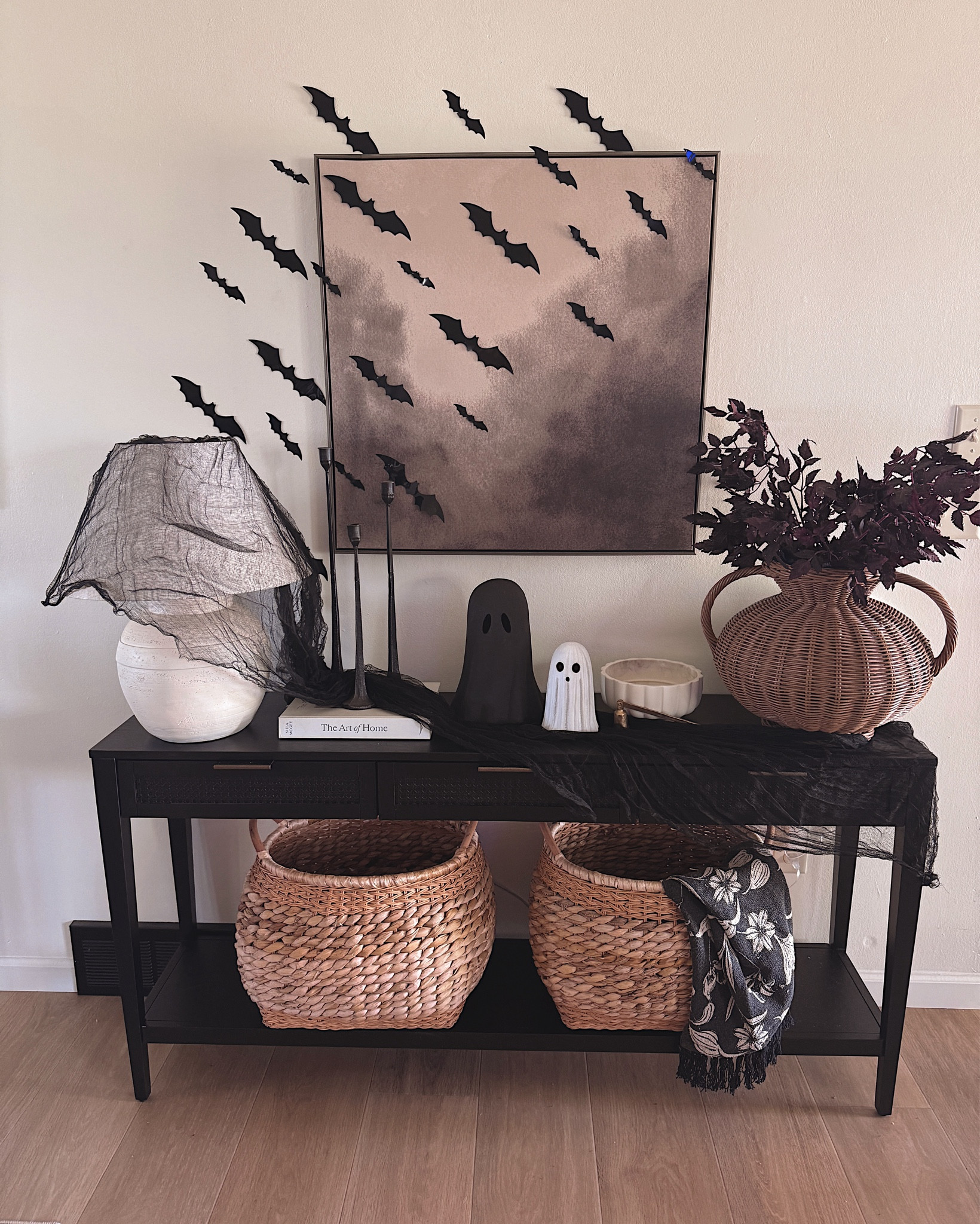 Minimal fall table styling with nesting wood stools, a rustic tray, moody vase, soft florals, and stone pumpkins. 🍂 Perfect neutral fall home inspiration! #falldecorideas #neutralhomedecor #cozycorner #fallstyling 