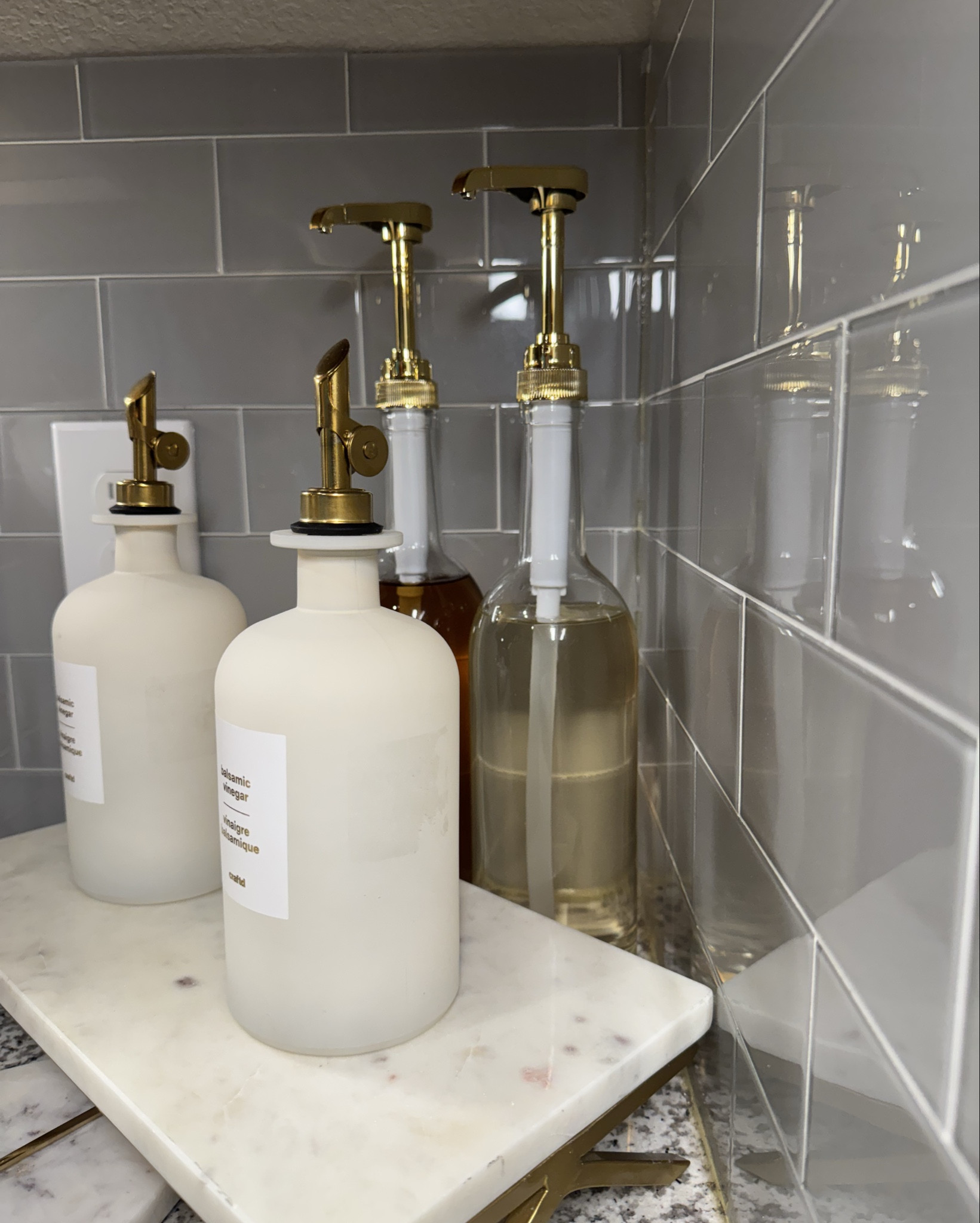 Glass syrup bottles with gold pour spouts — I use mine for coffee syrups. Functional, sleek, and makes the counter look intentional instead of cluttered.

#LTKFindsUnder50 #LTKHome