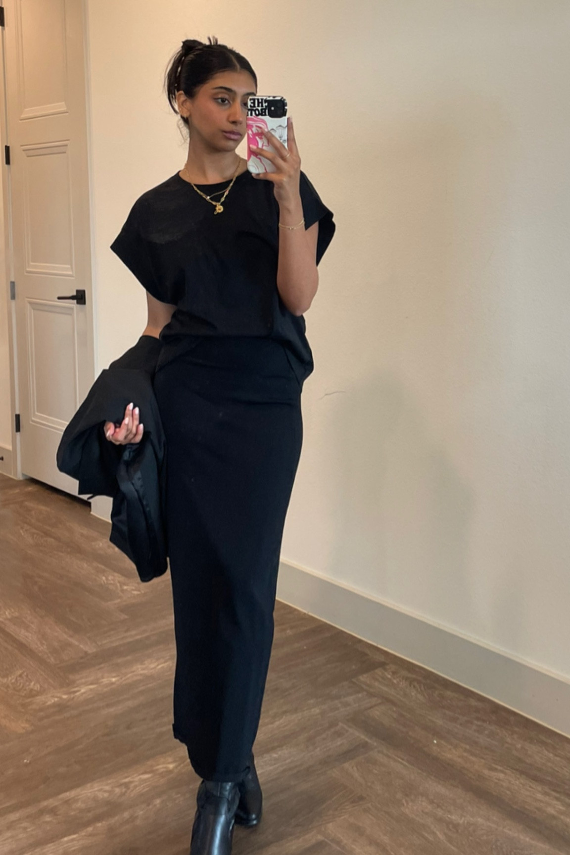 All black work outfit of the day! A muscle tee type shirt, black skirt, cowgirl boots, and blazer in hand🖤

#LTKunder100 #LTKstyletip #LTKworkwear