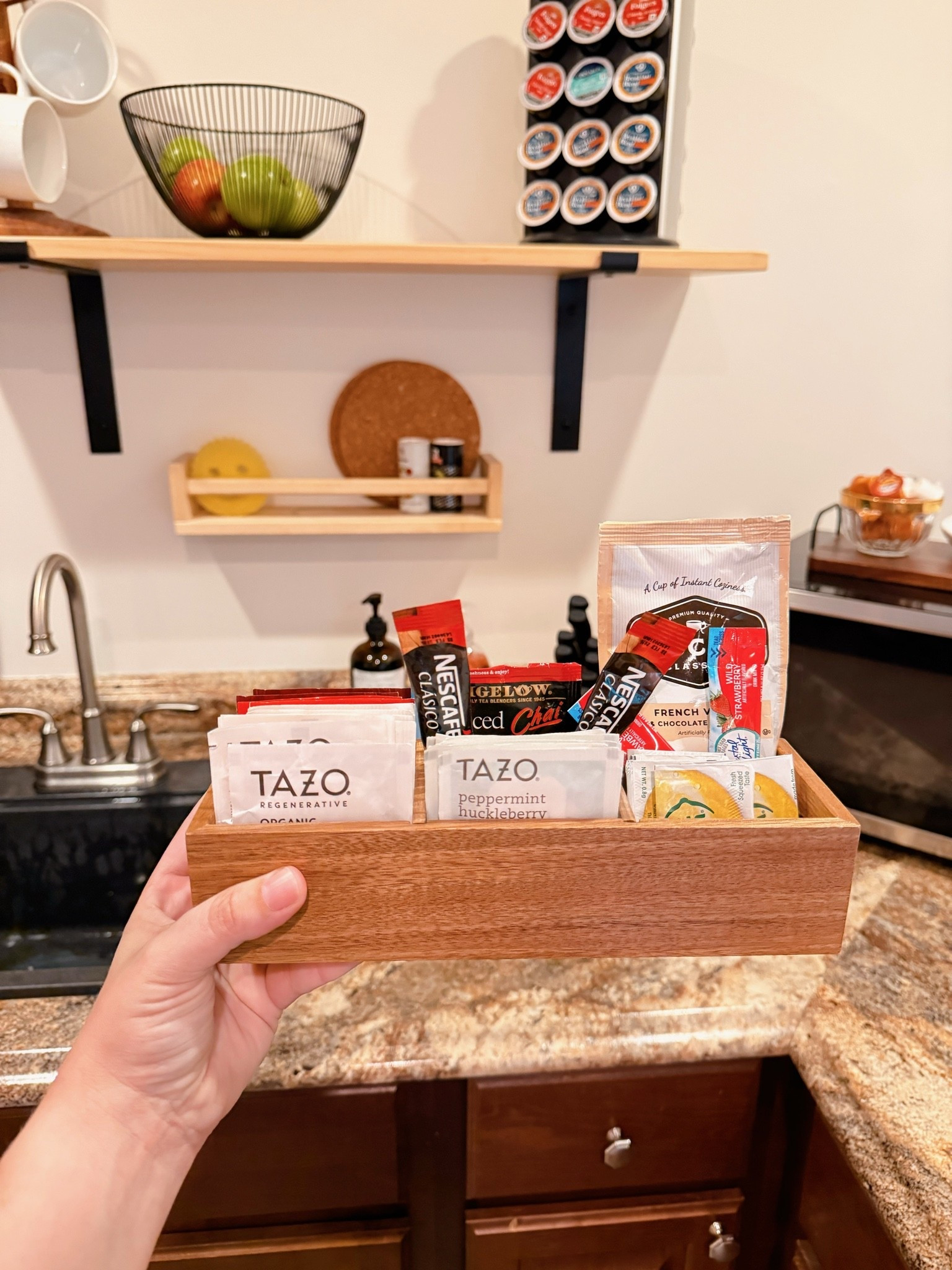 I put together a little tea station in our Airbnb kitchenette with a tea organizer and electric kettle for fellow tea drinkers. I also keep half and half and honey on the shelf and tucked in some instant coffee, flavor packets (for bottled water) and lemon packets for extra options. They may not get used often, but I want everyone who stays with us to feel comfortable, cared for and at home in our space.