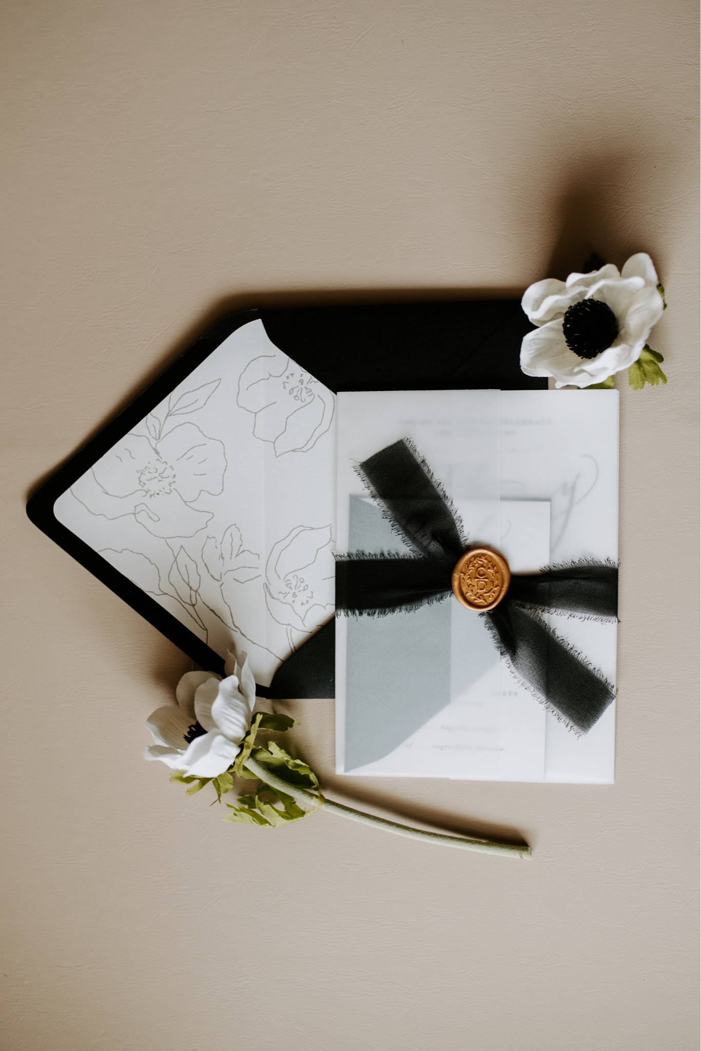 since I am a graphic designer, I DIYed my winter wedding invitations. I wanted them to have a black tie feel with gold wax seals and black ribbon. 

#LTKwedding