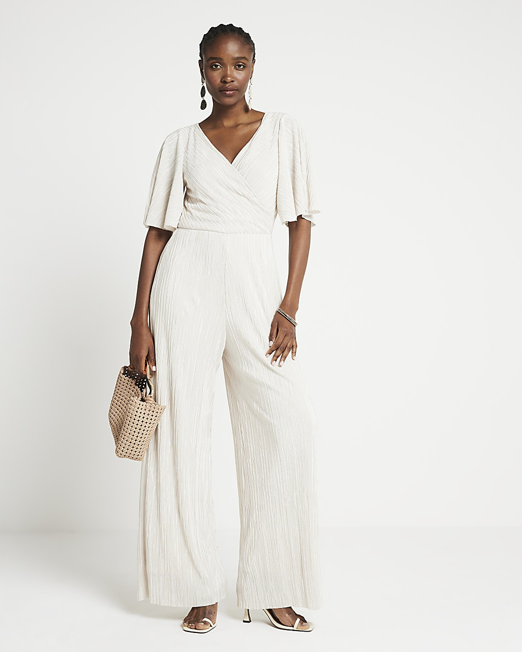 Cream plisse wide leg jumpsuit | River Island (UK & IE)