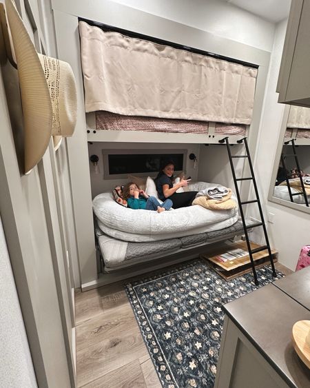 Girl’s bunk room in RV - we installed a curtain and the rug is SO comfy! The Amazon human dog bed won and my youngest sleeps on it on top of the pull out sofa bed 🛌 #amazon #dogbed #bunks #bunkroom

#LTKkids #LTKfamily #LTKhome