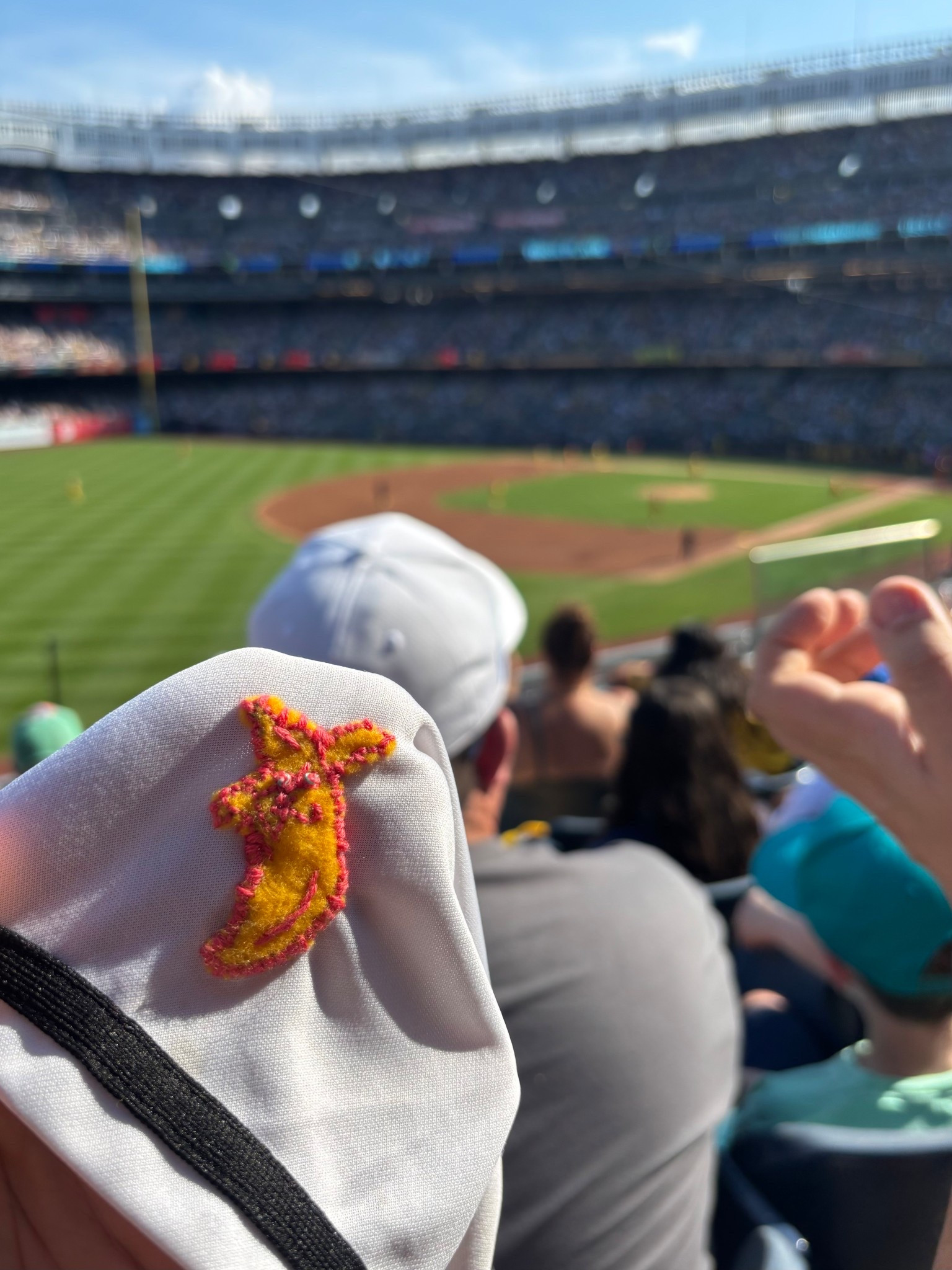We were lucky enough to go to the Savannah Bananas game today at Yankee’s stadium with the kids! 

We had a great time, and it was the first baseball game my daughter went to that she didn’t open her book at, so you know it was a good time! 

But, I got a last minute request to make a Bananas “patch” to add to the kids jerseys while we were on our way. 

So I grabbed some of my embroidery supplies on our way out the door, and had a basic outline stitched by the time we arrived. I did a quick blanket stitch to attach it to the sleeve, but I’ll go back through and even it out when we’re not at an event 😂😅

It’s certainly not perfect, but for a freehanded banana logo, on the road…I think it’s pretty cute.

#LTKOver40 #LTKFamily #LTKTravel