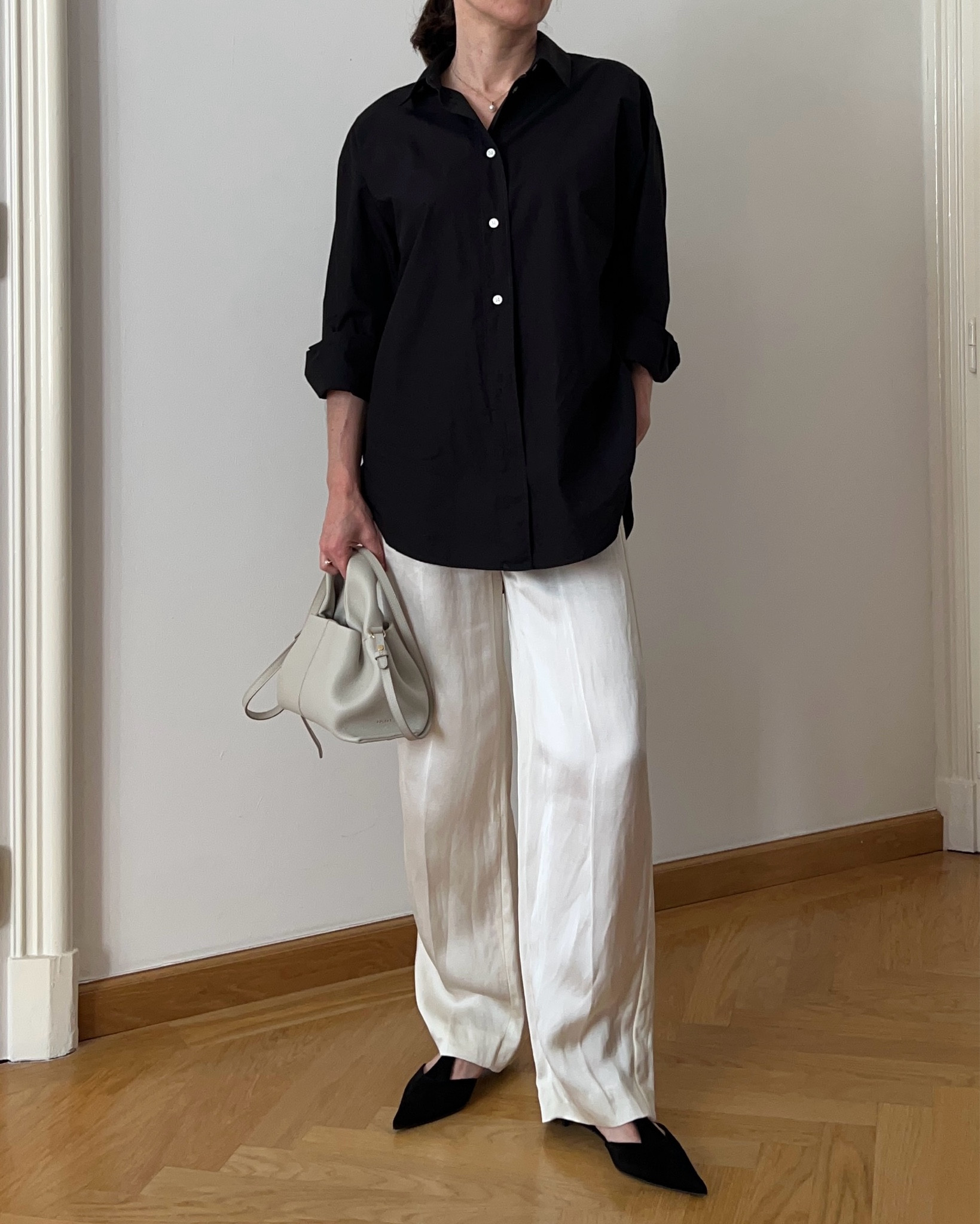 Black shirt, white satin trousers, suede slingbacks, cream handbag, Spring outfit, Summer outfit, pearl jewellery, minimal outfit, simple outfit, Spring trends, pearl necklace, pearl ring, pearl earrings, Polene bag

#LTKfindsunder100 #LTKstyletip #LTKeurope