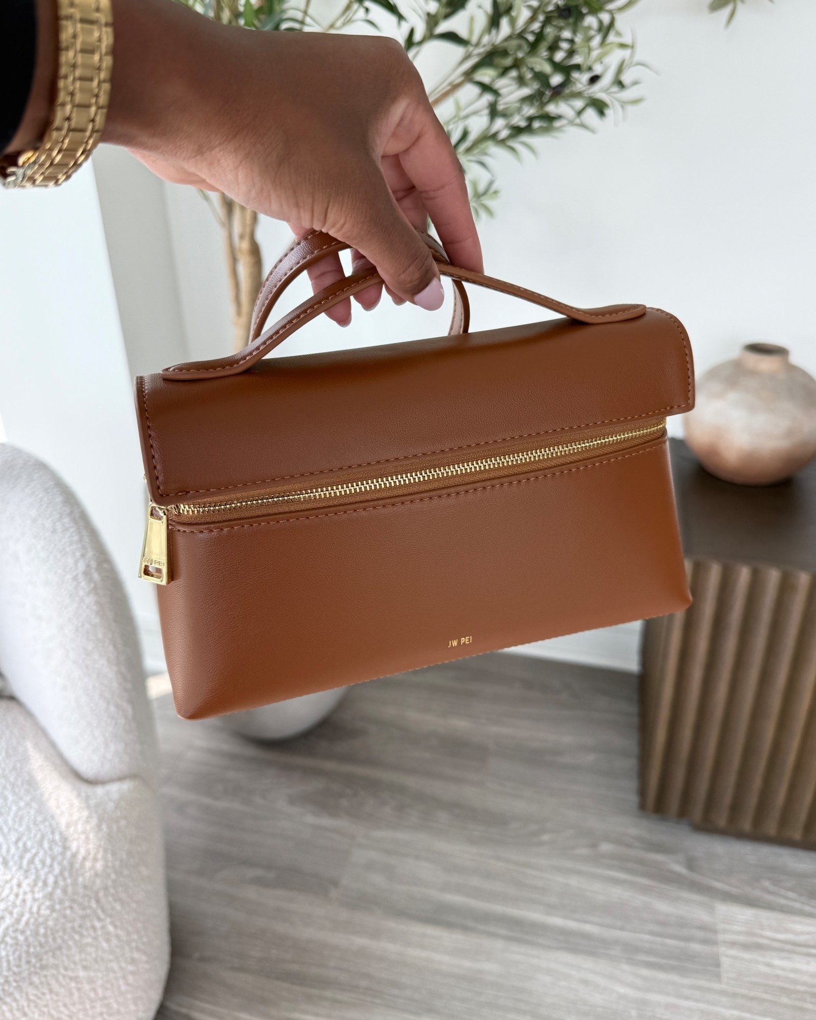 My new brown top handle bag with gold hardware for summer. It also comes with an adjustable strap to turn it into a crossbody! 🤎

#LTKFindsUnder100 #LTKSeasonal #LTKItBag