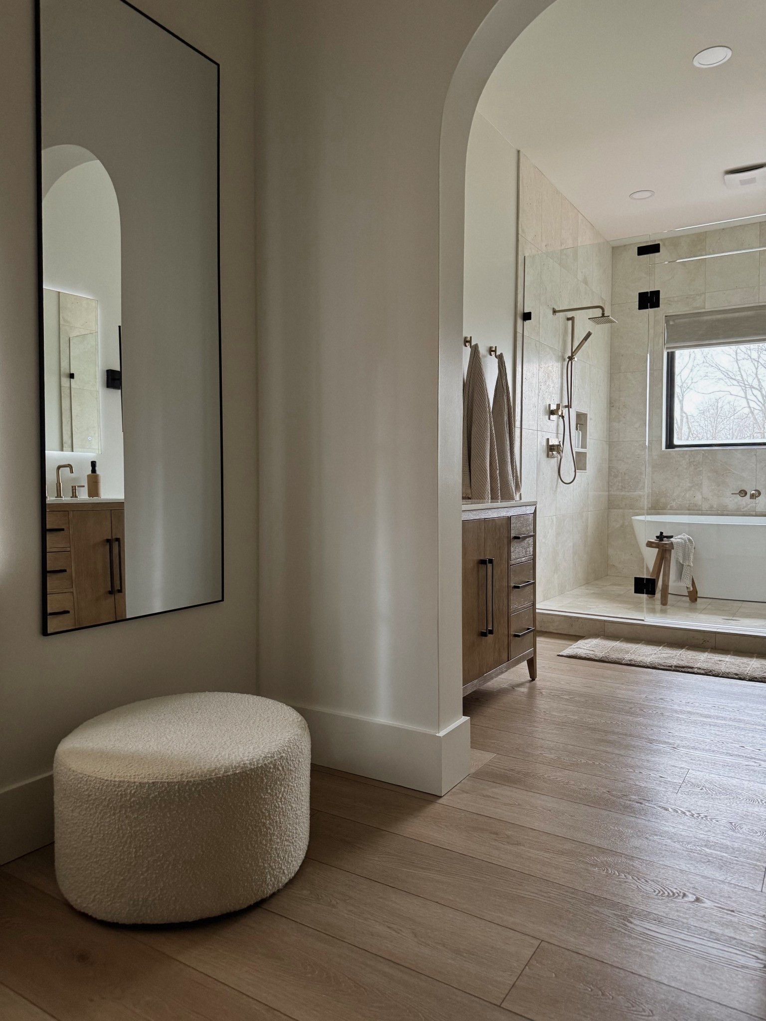 View from my primary closet into primary bathroom.

Soft, neutral, organic and spa-like with warm wood details 🛁🤎✨

#LTKHome #LTKselfcare #LTKSaleAlert