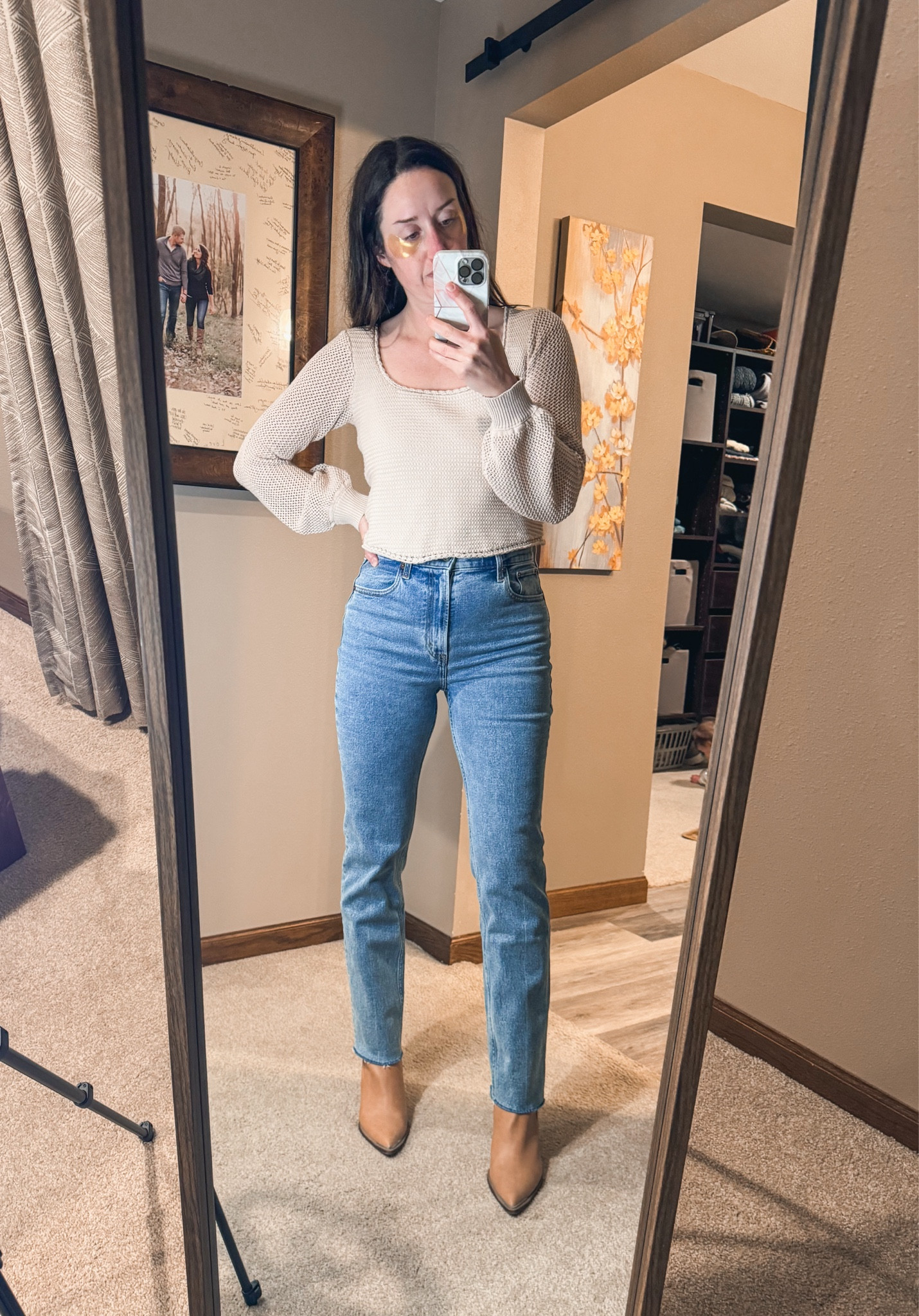 This sweater is so good. Perfect length. Wearing a medium and 27 in the jeans.