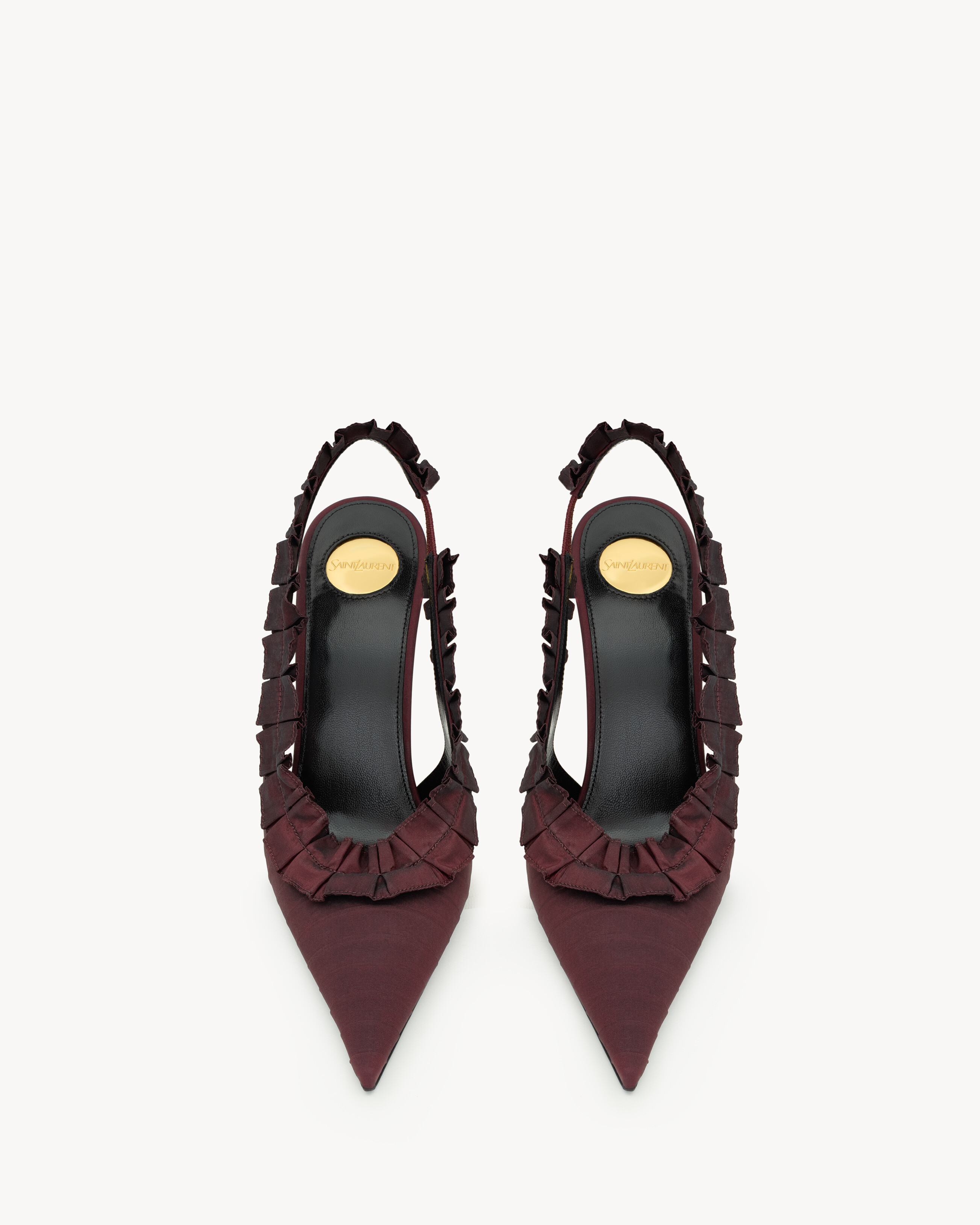 slingback pumps decorated with hand-stitched couture ruffles, featuring a pointed toe and covered... | Saint Laurent Inc. (Global)