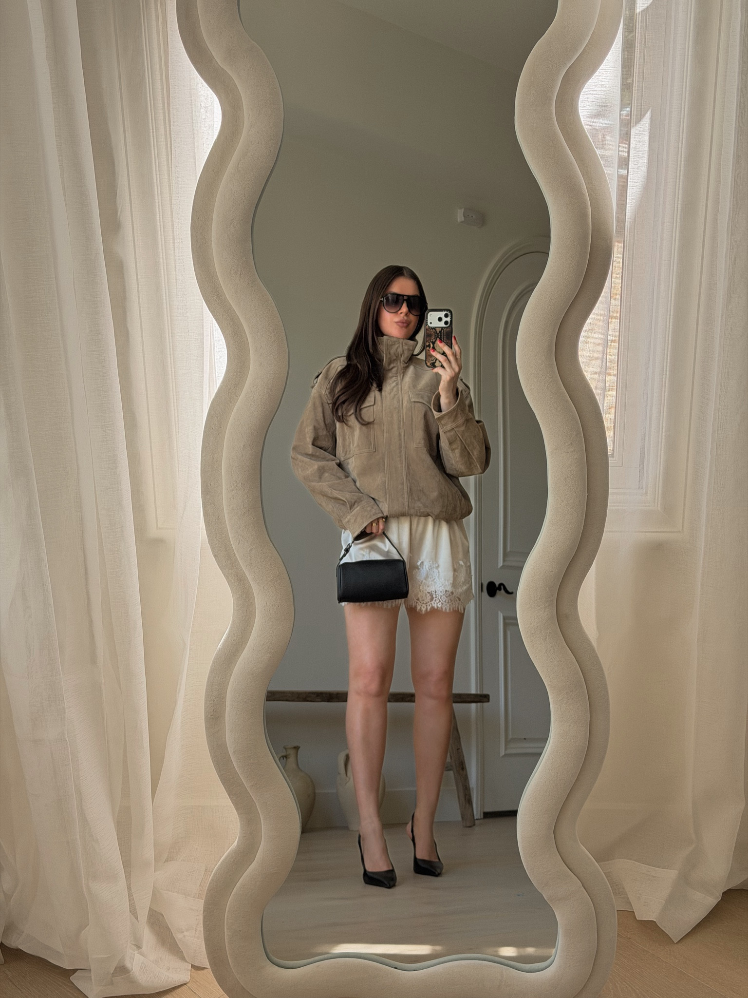Spring outfit: cool girl style. Chic and simple outfit for spring. 
Styling lace trim shorts with white tank top, black leather sling backs, beige suede jacket, gold jewelry, aviators and a chic 90s style black leather purse. 
Wearing size S jacket, size M shorts 
#springoutfits #chic #coolgirl #outfitideas

#LTKootd #LTKgrwm #LTKSeasonal