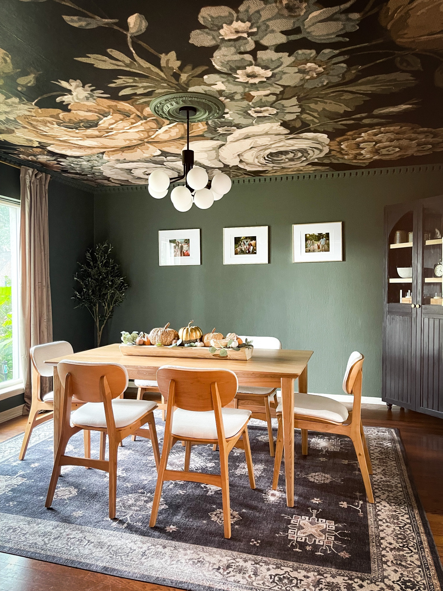 This moody dining room is full of complimentary decor and the Scandinavian seating is an elegant choice for this formal dining room.

#LTKhome