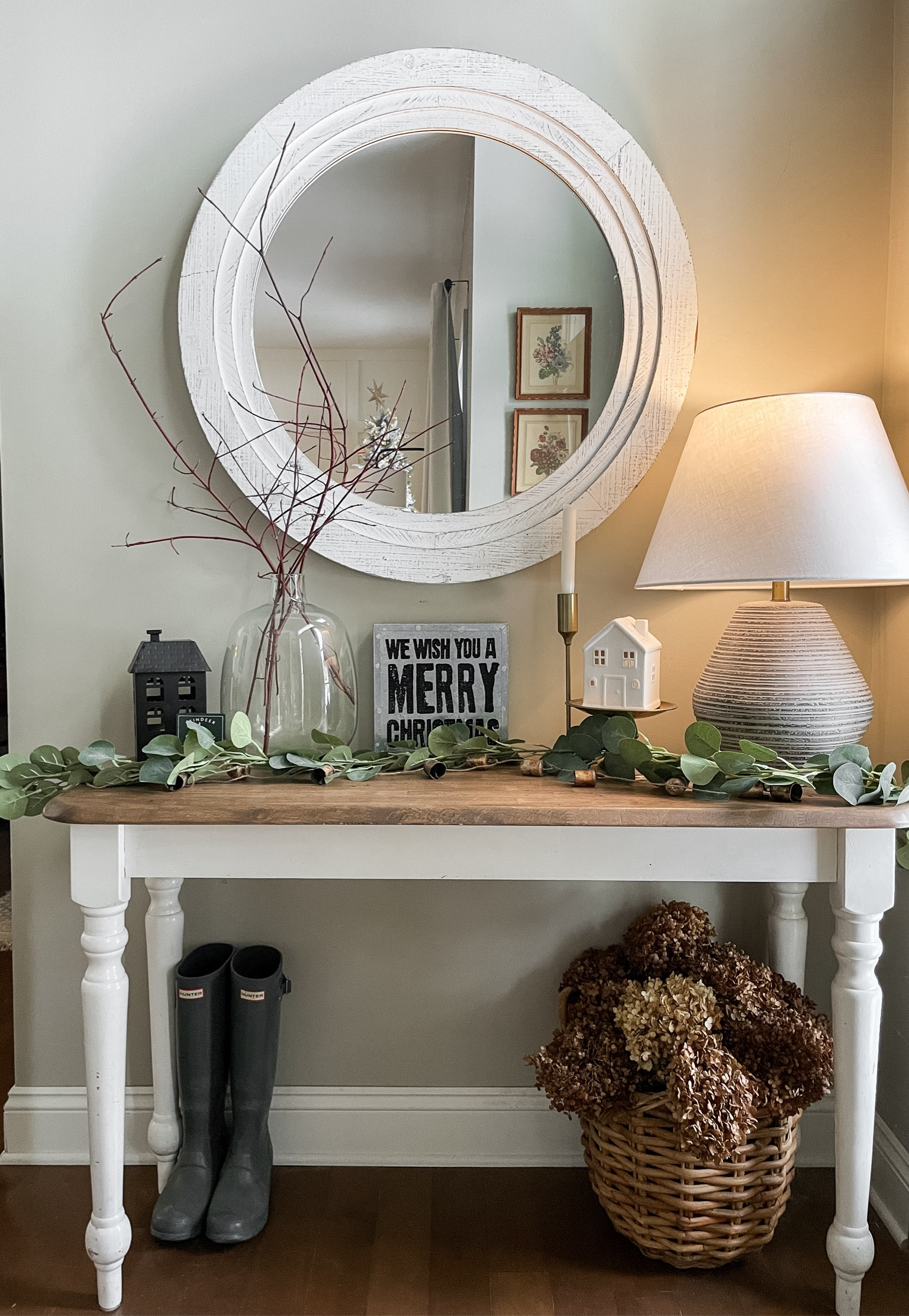Our entryway table is full of twinkling lights, small houses and Christmas garland.  

Console table.  Table lamp.  Christmas houses.  Hunter rain boots.  Christmas decor.  

#LTKHoliday #LTKhome #LTKSeasonal