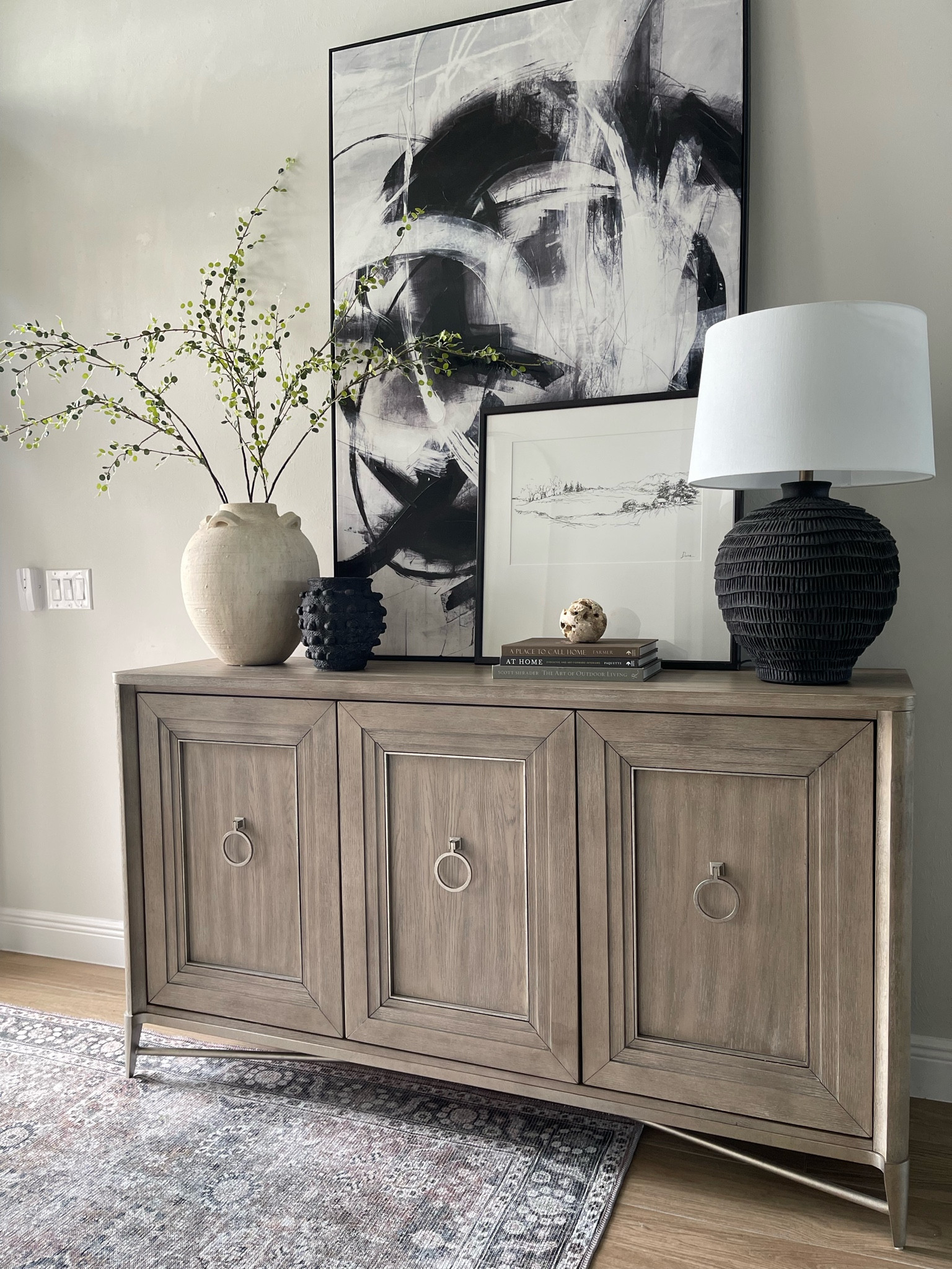 Console Table Styling
Console table, black lamp, arhaus vase, black and white art, anthropologie vase, budget friendly, For any and all budgets. mid century, organic modern, traditional home decor, accessories and furniture, home decor #wayfair #arhaus # anthropologie 

#LTKFind #LTKhome #LTKSeasonal
