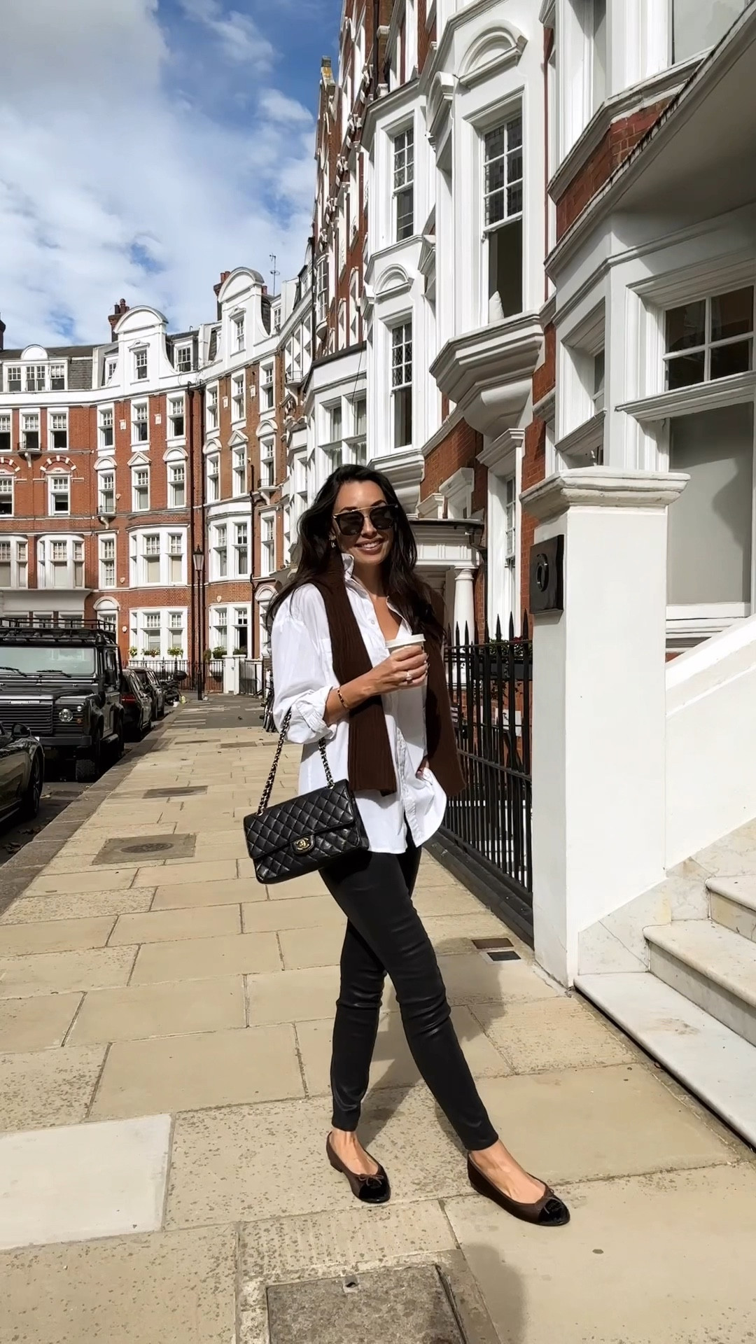 Kat Jamieson wears Chanel ballet slippers, a cashmere sweater and white button down in London. Fall outfit, classic style, skinny jeans. 

#LTKSeasonal #LTKVideo #LTKFallSale
