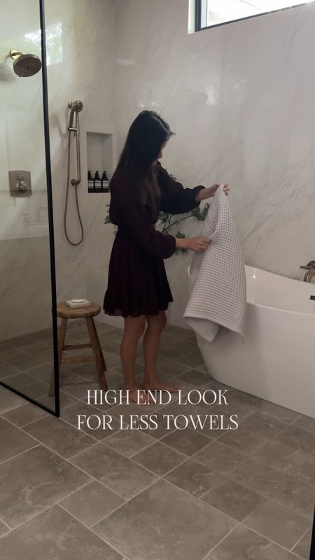 High end looking towels can be expensive, but I found these at target for a fraction of the price. Definitely l elevates the look of my bathroom. Brass faucet shower white tub stool wood tool op bottles hand towel bath towel uncalyptus green branches Wayfair target amazon

#LTKsalealert #LTKfindsunder50 #LTKhome
