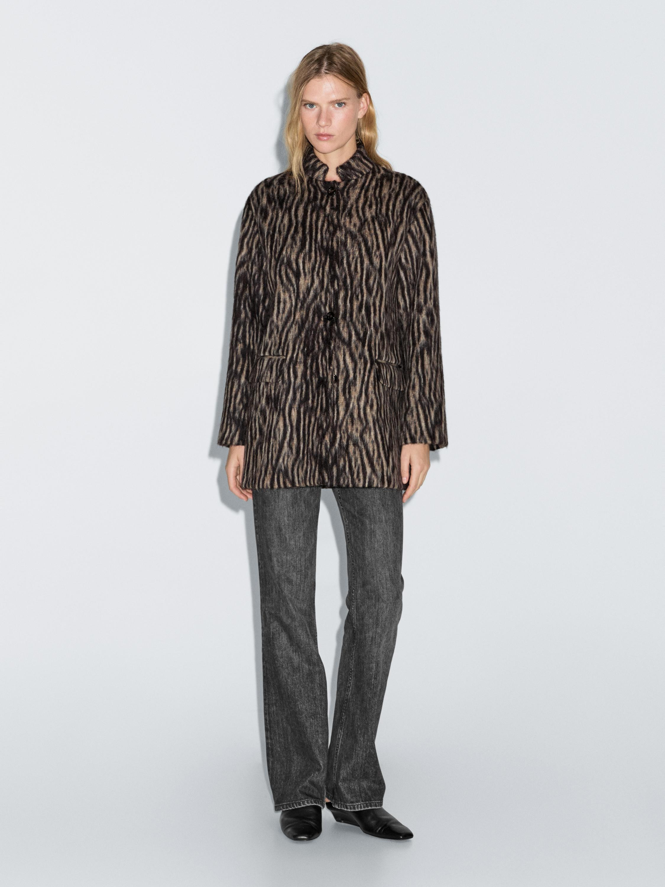 Animal print coat made of fabric with wool. Stand-up collar. Long sleeves. Button-up front. Two f... | Massimo Dutti UK
