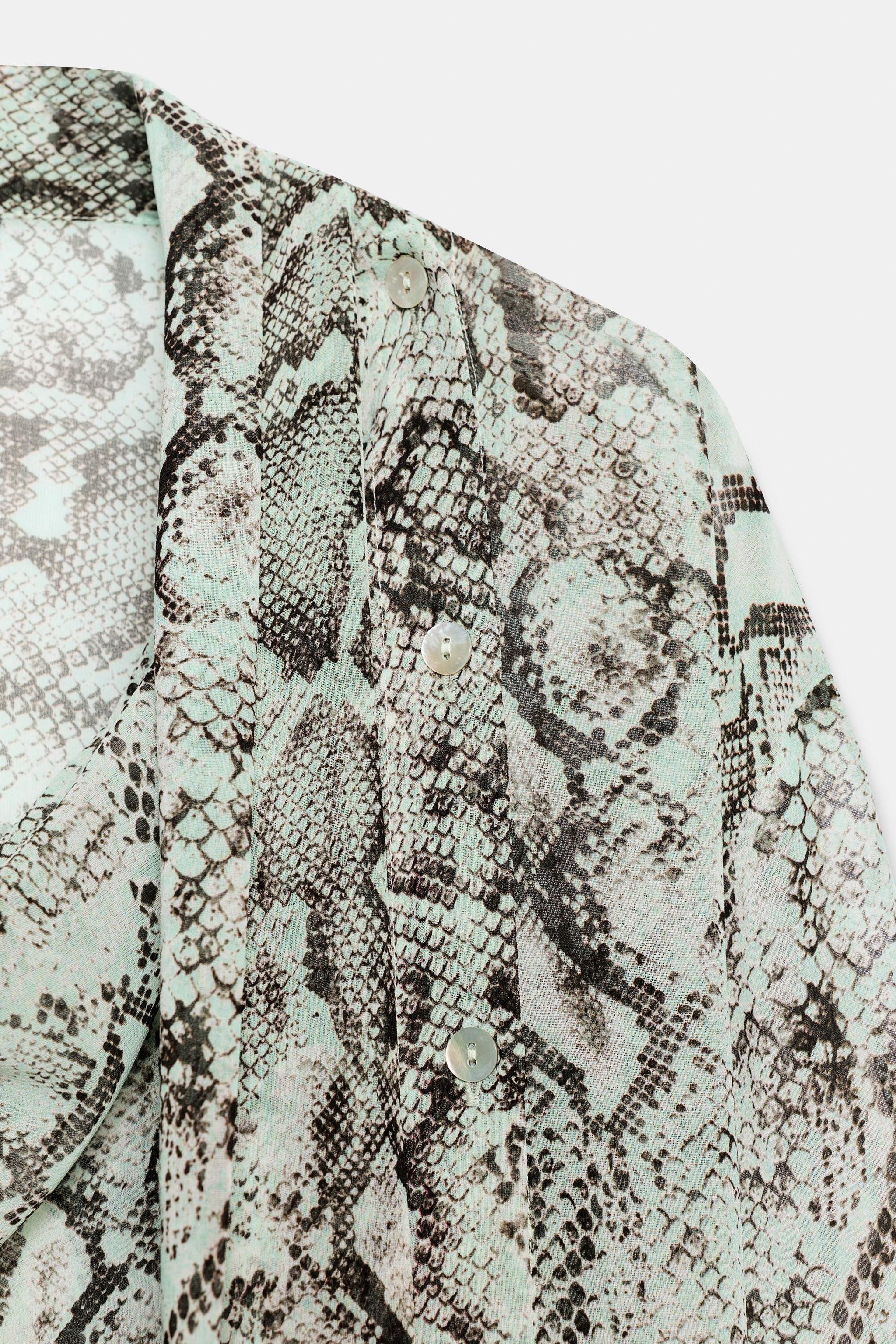 Long-sleeve shirt with a fluid collar. Cross-over front button fastening. | Zara US