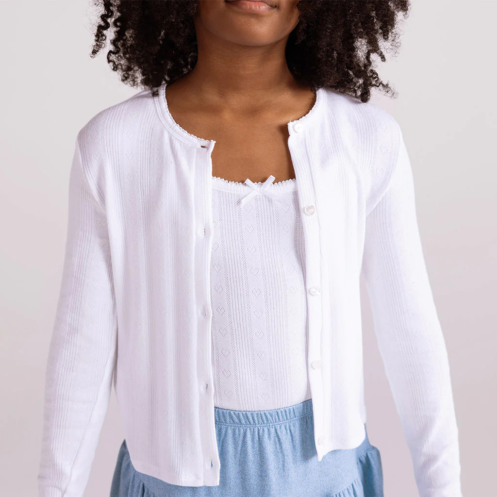 Solid Pointelle White Girls Ruffled Long Sleeve Pullover | White | Posh Peanut