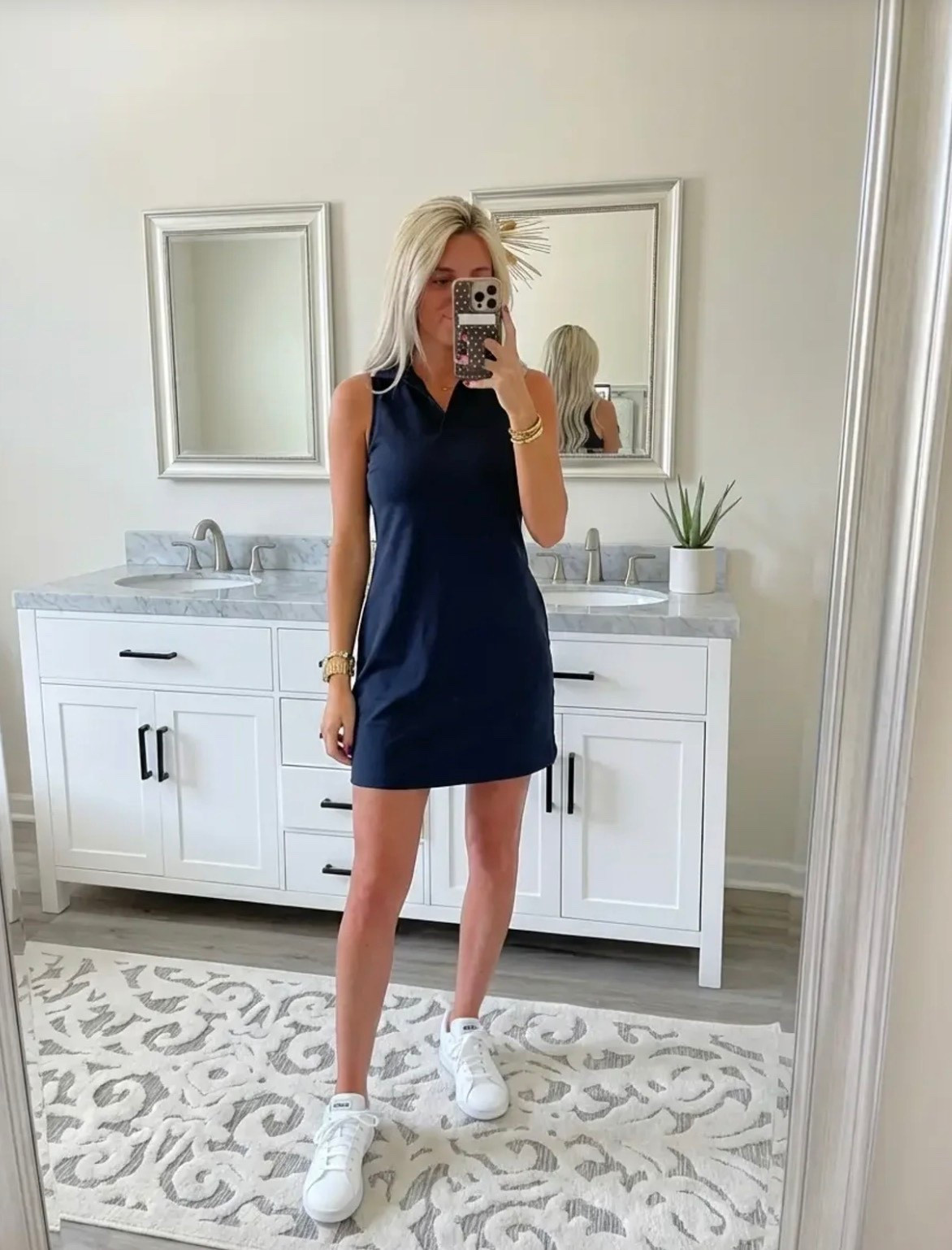 
Bright, lifestyle influencer selfie in a minimalist dressing room mirror. A stylish blonde woman with long beachy waves wears a green and white striped sleeveless polo dress paired with white Adidas sneakers and gold bracelets. The look is sporty-chic and effortless. Neutral dressing room background with soft lighting, clean wood floors, and a relaxed summer vibe. The aesthetic is preppy, travel-ready, and Instagram-worthy — Ralph Lauren meets casual golf resort style. The mood is confident, playful, and polished.

⸻

Caption

Sporty, comfy, and ready for wherever the day goes ✨
This is my favorite kind of outfit — easy, travel-ready, and cute enough for anything from running errands to grabbing lunch or hopping on a flight.

Athleisure but make it preppy chic 💚

— Heidi

⸻

Hashtags

#trendyheidi
#trendywithapassport
#sportychic
#athleisurestyle
#preppystyle
#summeroutfits
#everydaystyle
#adidasstyle
#casualchic
#airportoutfit
#weekendstyle
#tenniscore
#golfstyle
#traveloutfit
#effortlessstyle
#womenwithstyle
#styleinspo
#outfitinspo
#ootdfashion
#everydayfashion
#influencerstyle
#lookbookstyle
#amazonfashionfinds
#casualfashion
#fashionreels


#LTKSpringSale #LTKdayinmylife #LTKgrwm
