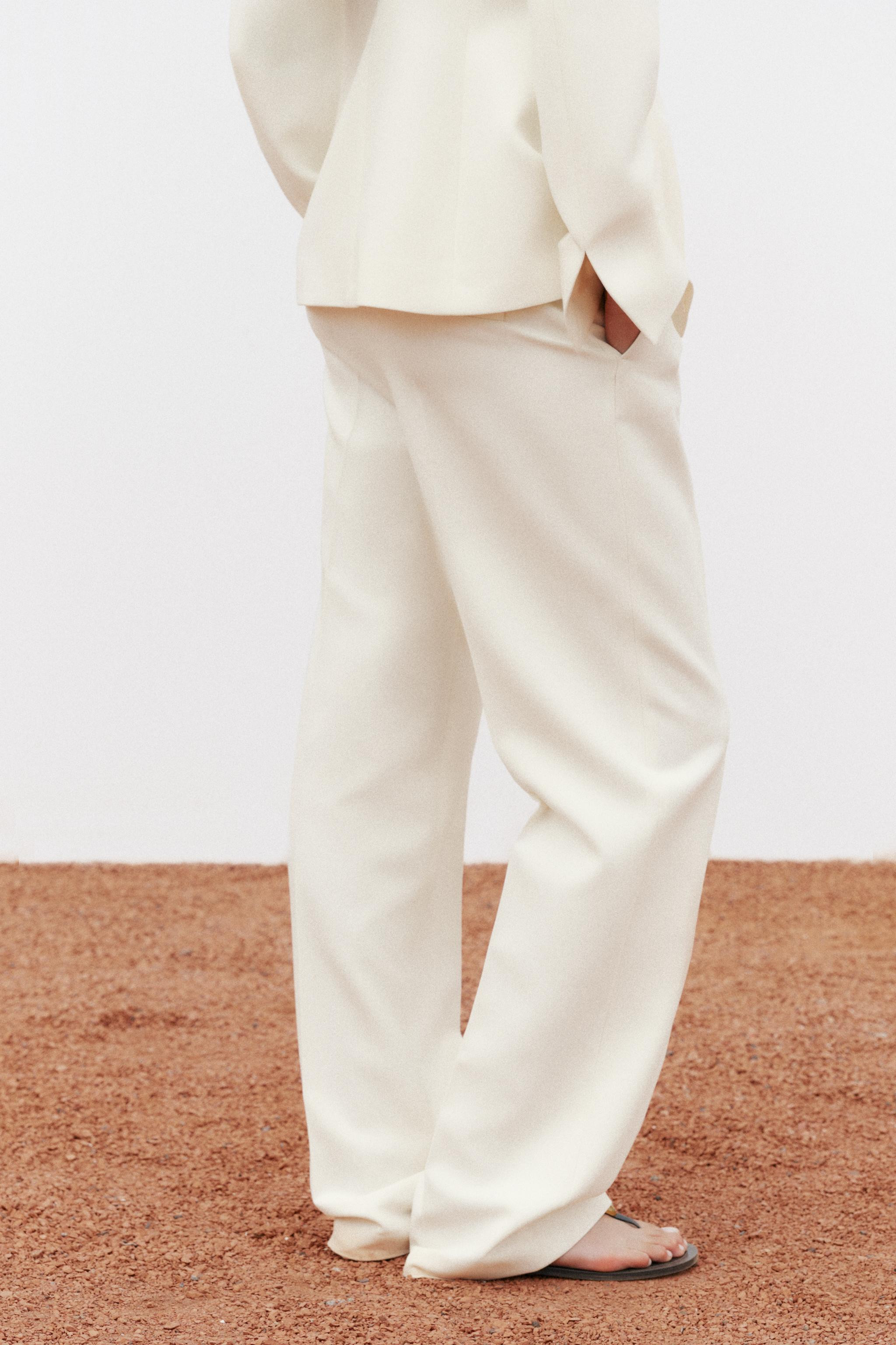 Pants with a high waist with front pockets and false back welt pockets. Straight leg. Front zip, ... | Zara US