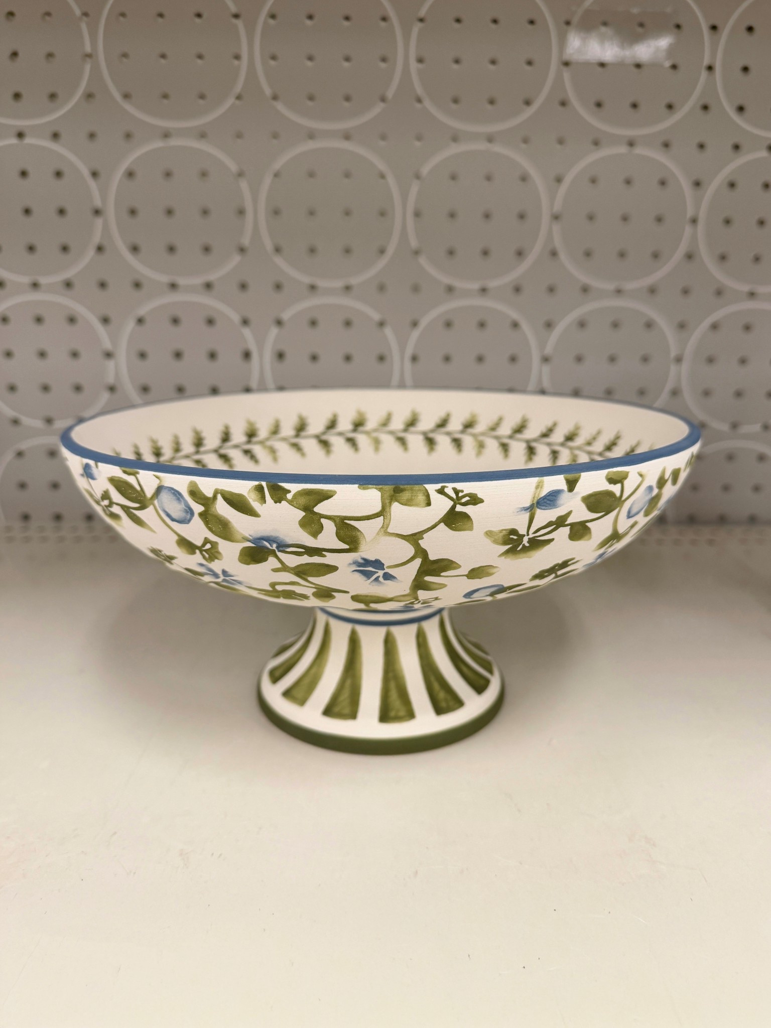 Cute Target home find! 🌿 The 10” Floral Painted Ceramic Footed Bowl from Threshold  has the prettiest green floral pattern with a blue rim and an elegant footed design. Such a charming home accent for a coffee table, console, or shelf. ✨ #TargetHome #HomeDecor #HomeAccent 

#LTKSaleAlert #LTKHome