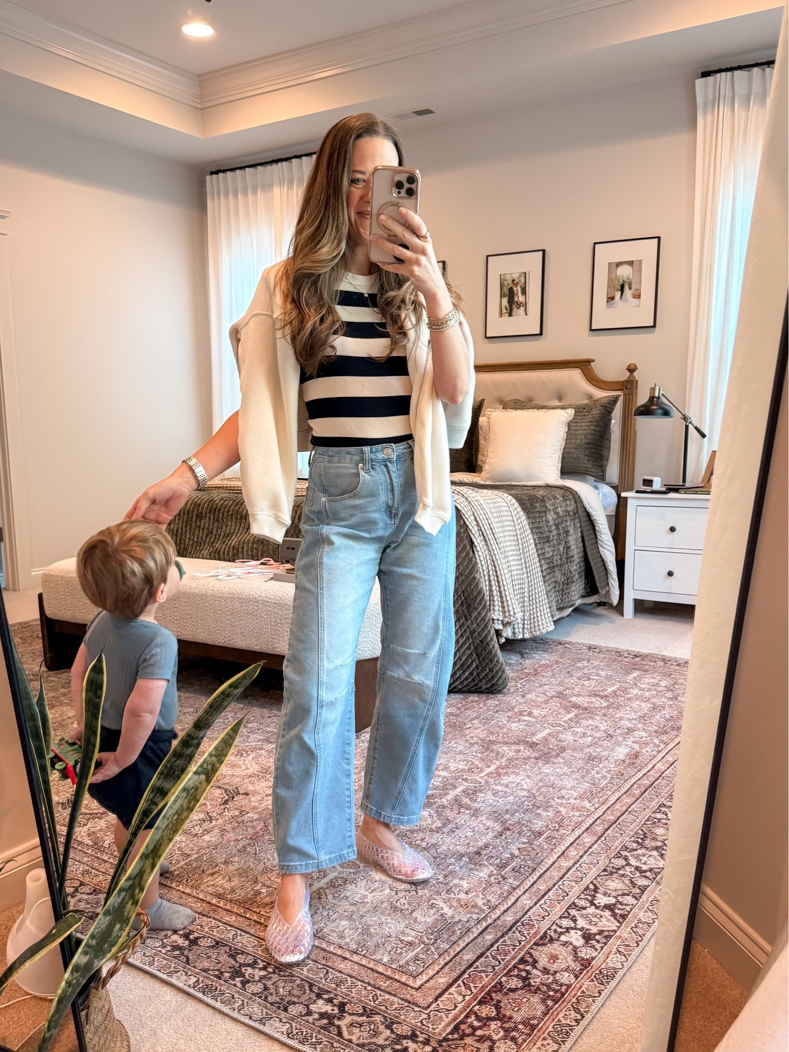 I’m normally not one for trends, but the clear jelly flats were too cute to pass up 🤍 Styled them with this navy and cream striped top and my Amazon barrel jeans for an easy casual mom outfit that still feels fun and current. Added a lightweight sweater over the shoulders for a little polish.

#LTKmomlife #LTKootd #LTKSeasonal